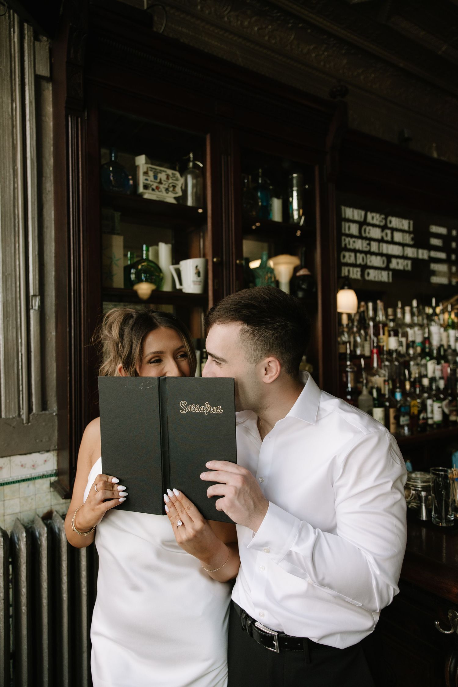Candid spring engagement session of a couple walking along the historic cobblestone streets of Old City Philadelphia.