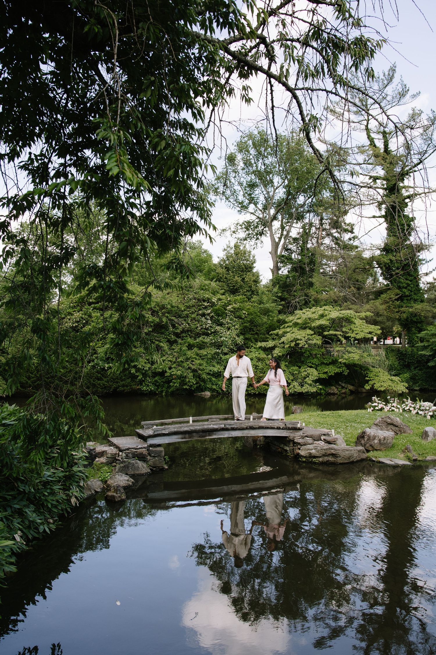 Romantic engagement session at Shofuso Japanese Garden in Philadelphia featuring serene landscapes, cherry blossoms, and soft natural light.