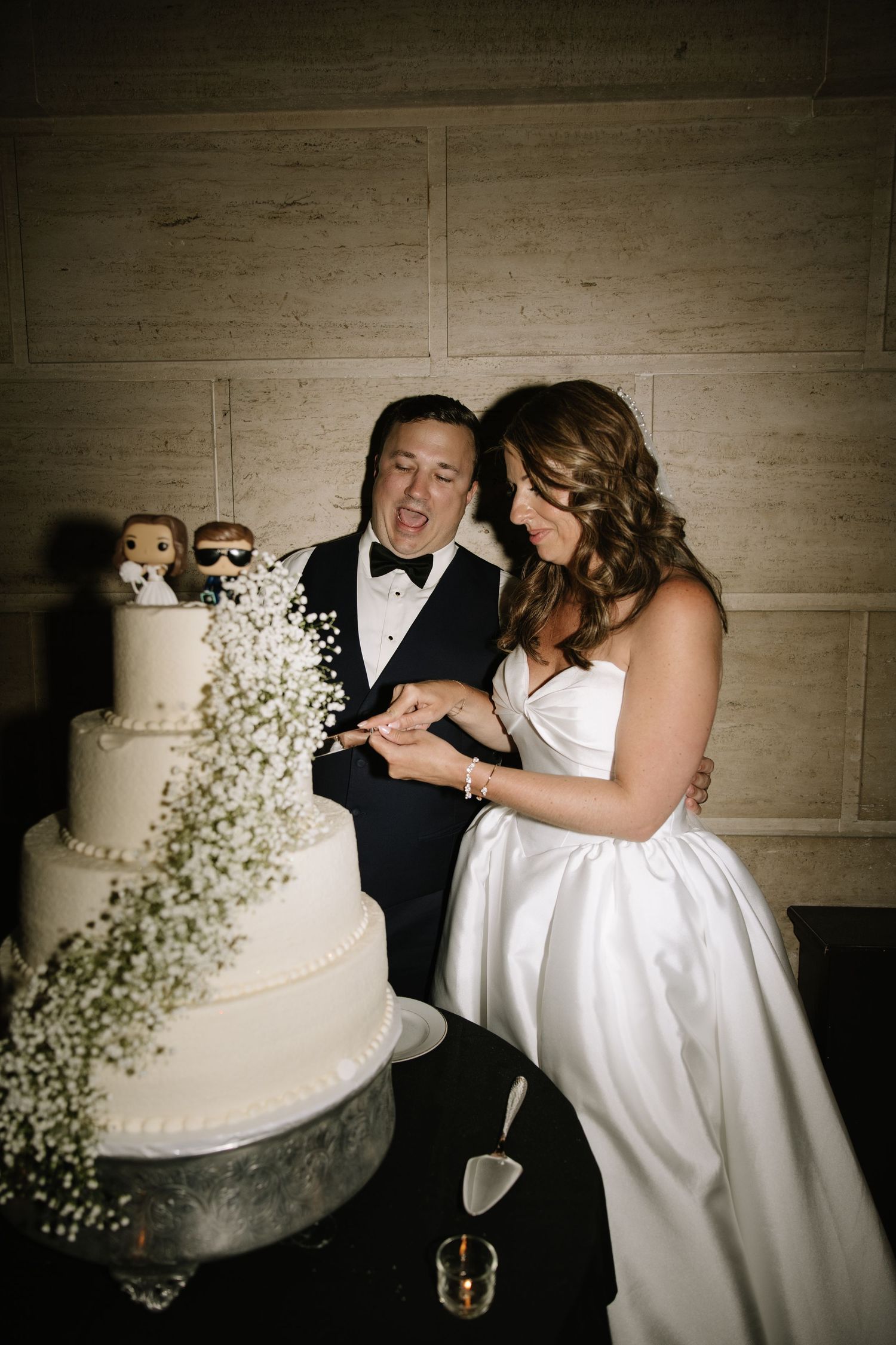 Romantic wedding portrait of newlyweds inside Philadelphia's historic Union Trust venue featuring elegant architecture and timeless details.