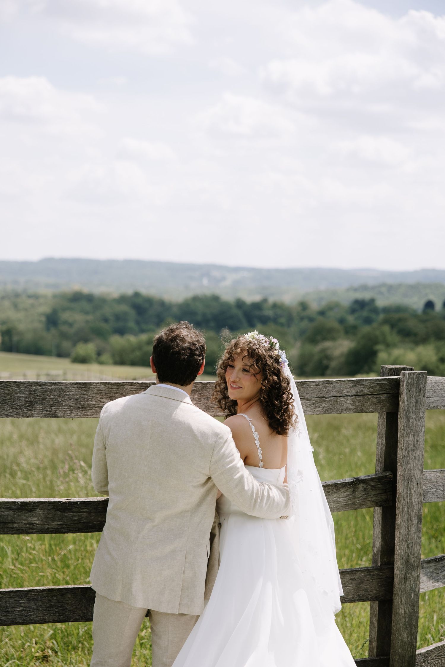 Golden hour wedding portrait of a couple overlooking the rolling hills of York County, Pennsylvania at Lauxmont Farms.