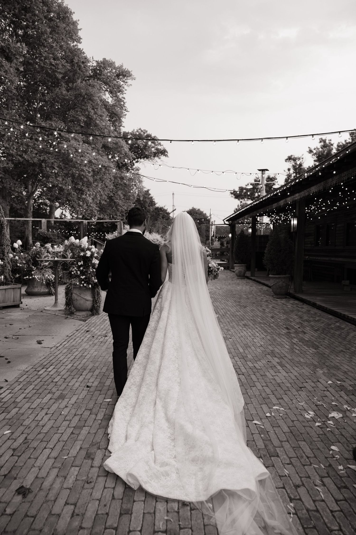 Terrain at Styers wedding ceremony with a couple exchanging vows surrounded by lush greenery and rustic garden details