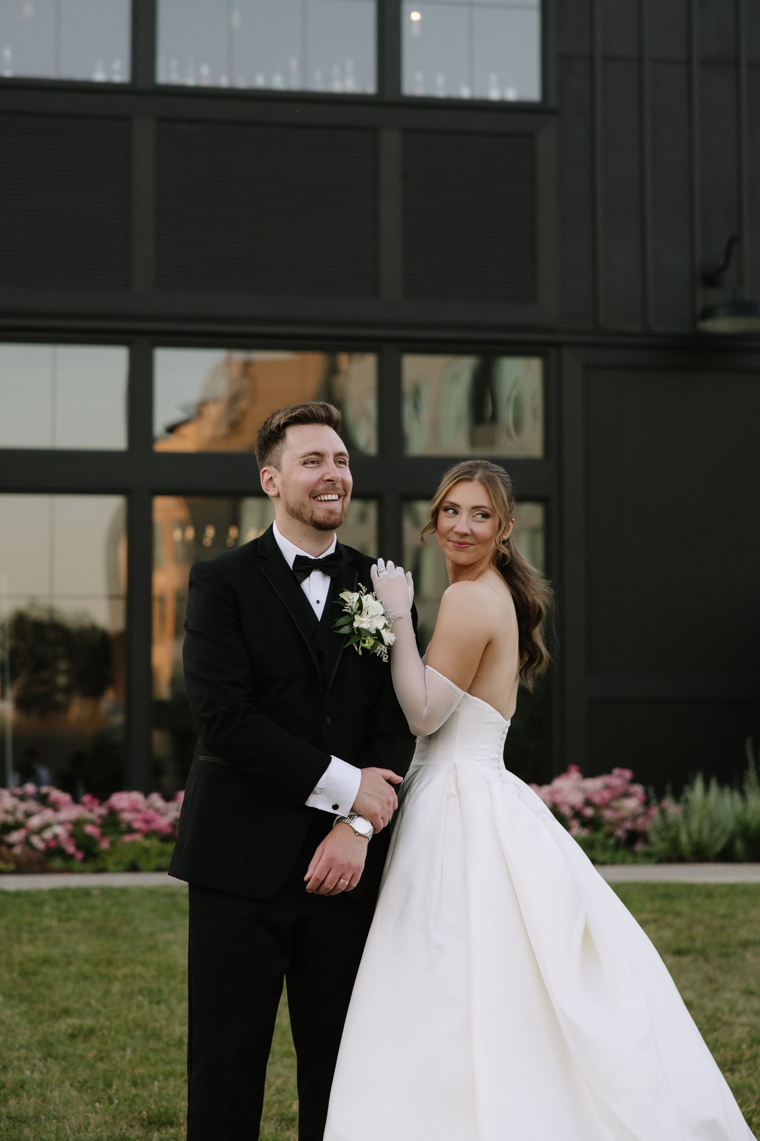candid wedding day moment photographed by a Philadelphia wedding photographer featuring newlyweds celebrating together.