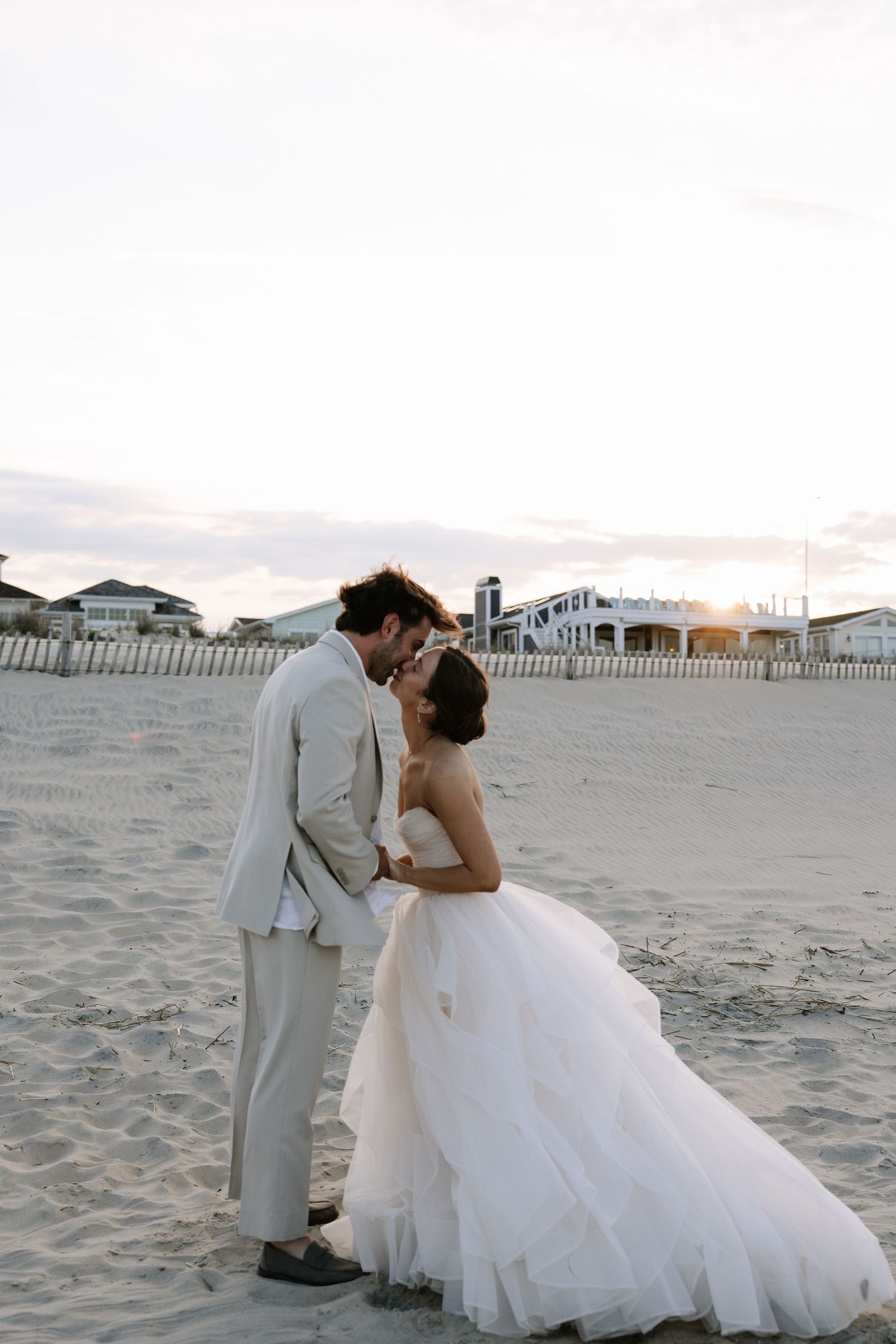 Elegant beach wedding in Bethany Beach, Delaware, featuring a bride and groom with scenic coastal views.