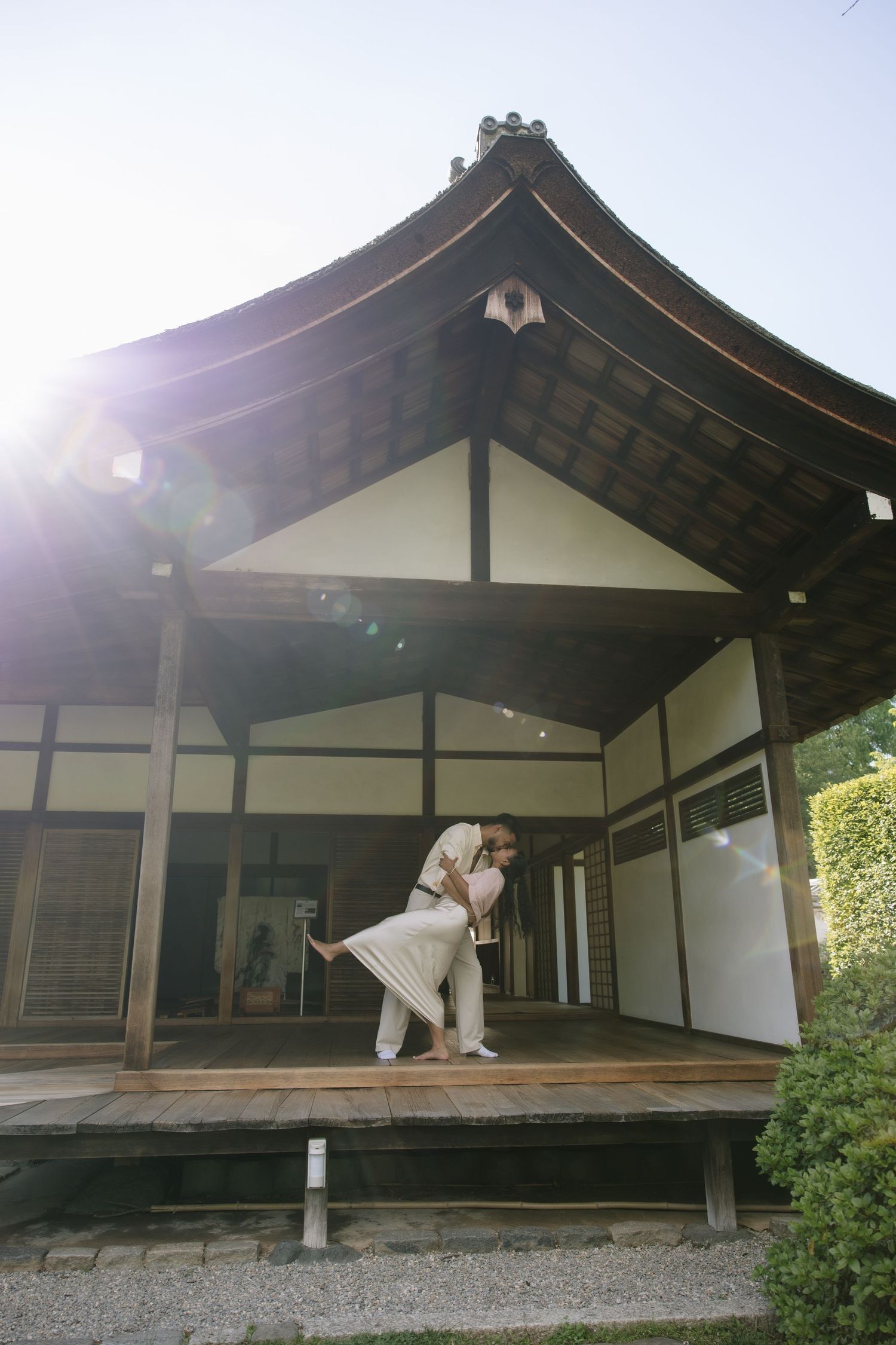 Romantic engagement session at Shofuso Japanese Garden in Philadelphia featuring serene landscapes, cherry blossoms, and soft natural light.