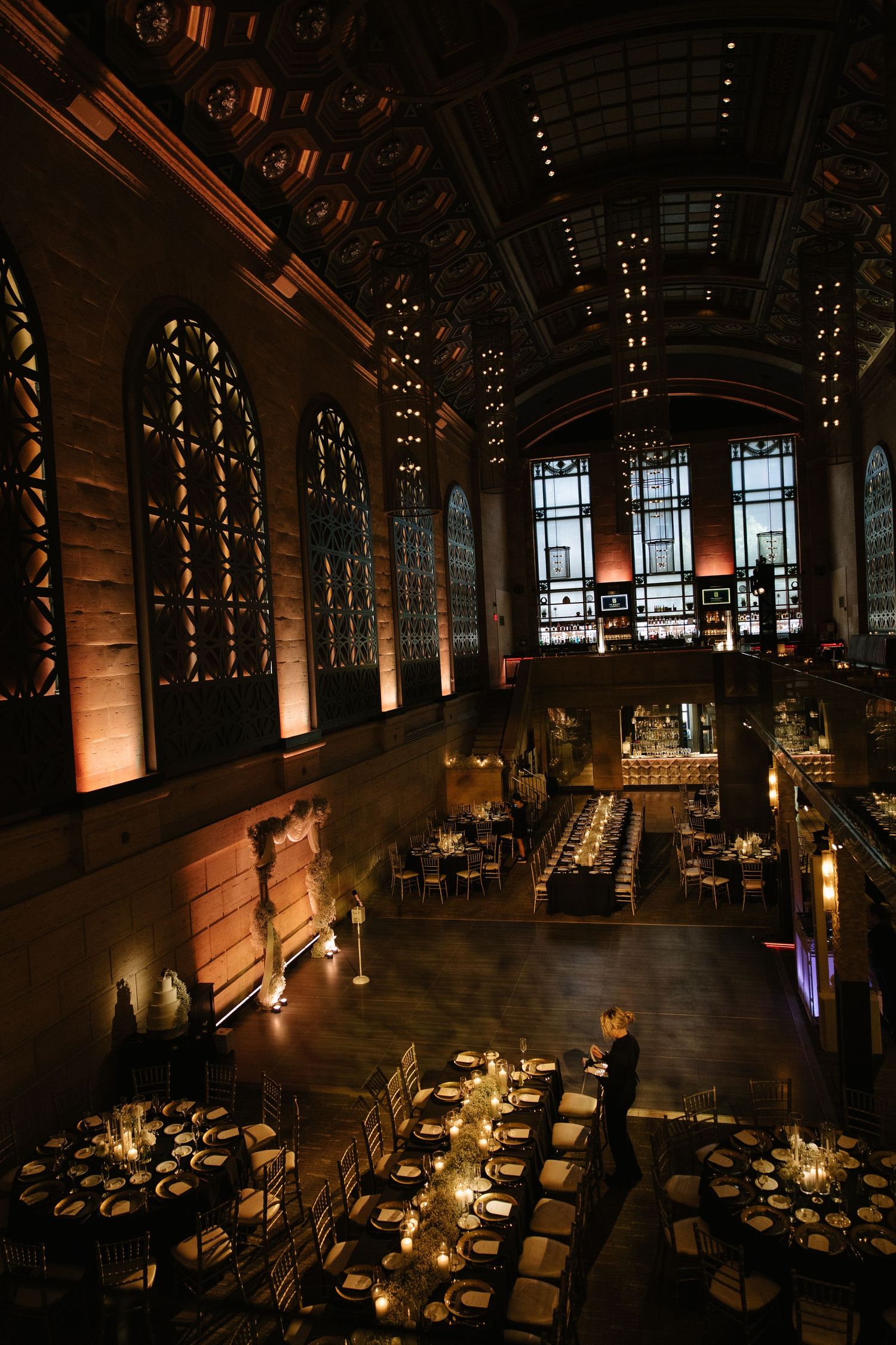 Romantic wedding portrait of newlyweds inside Philadelphia's historic Union Trust venue featuring elegant architecture and timeless details.