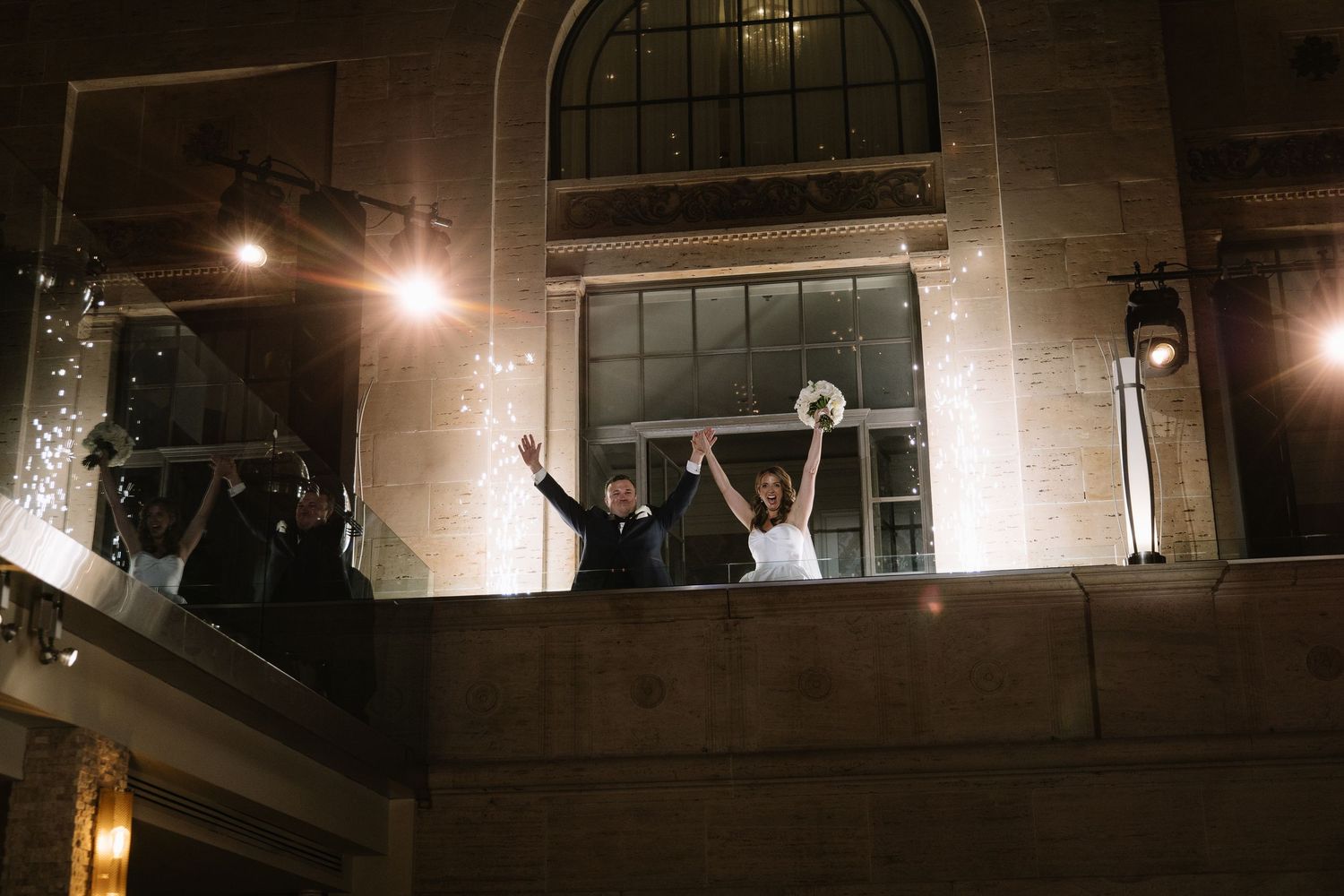 Romantic wedding portrait of newlyweds inside Philadelphia's historic Union Trust venue featuring elegant architecture and timeless details.