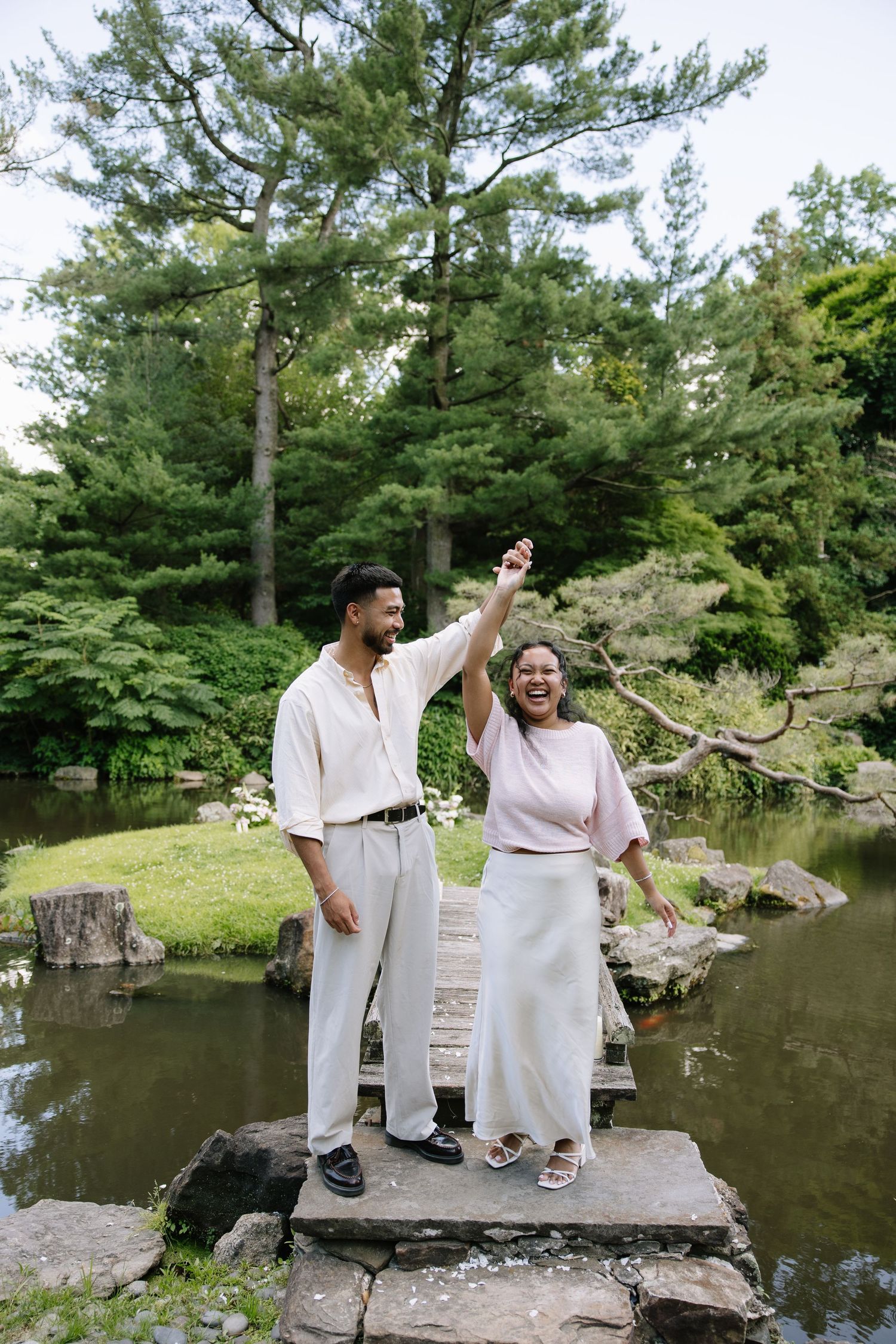 Romantic engagement session at Shofuso Japanese Garden in Philadelphia featuring serene landscapes, cherry blossoms, and soft natural light.
