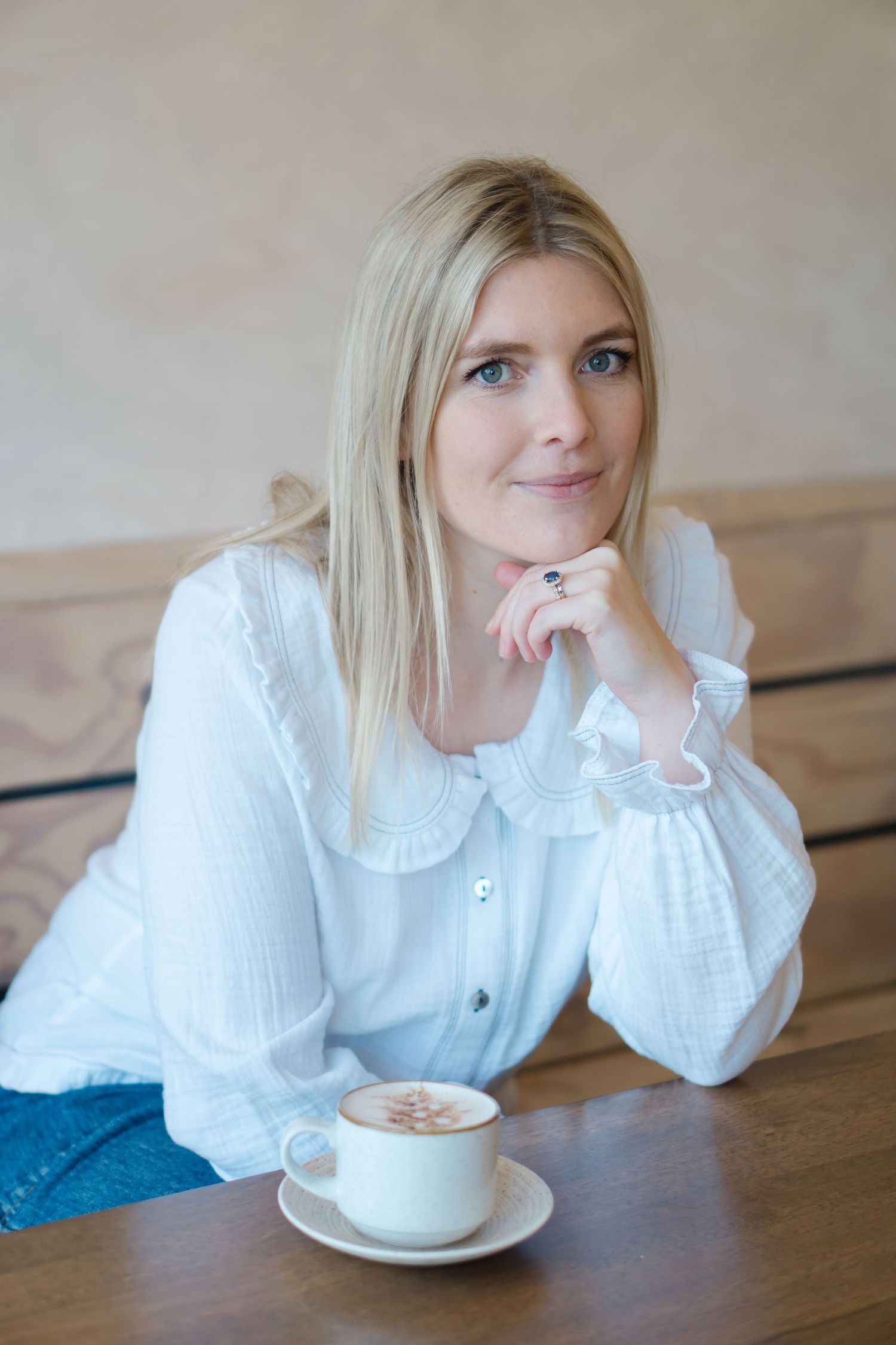 Braunton based illustrator and author Georgie Stewart, smiling on her shoot with Felicity Billen