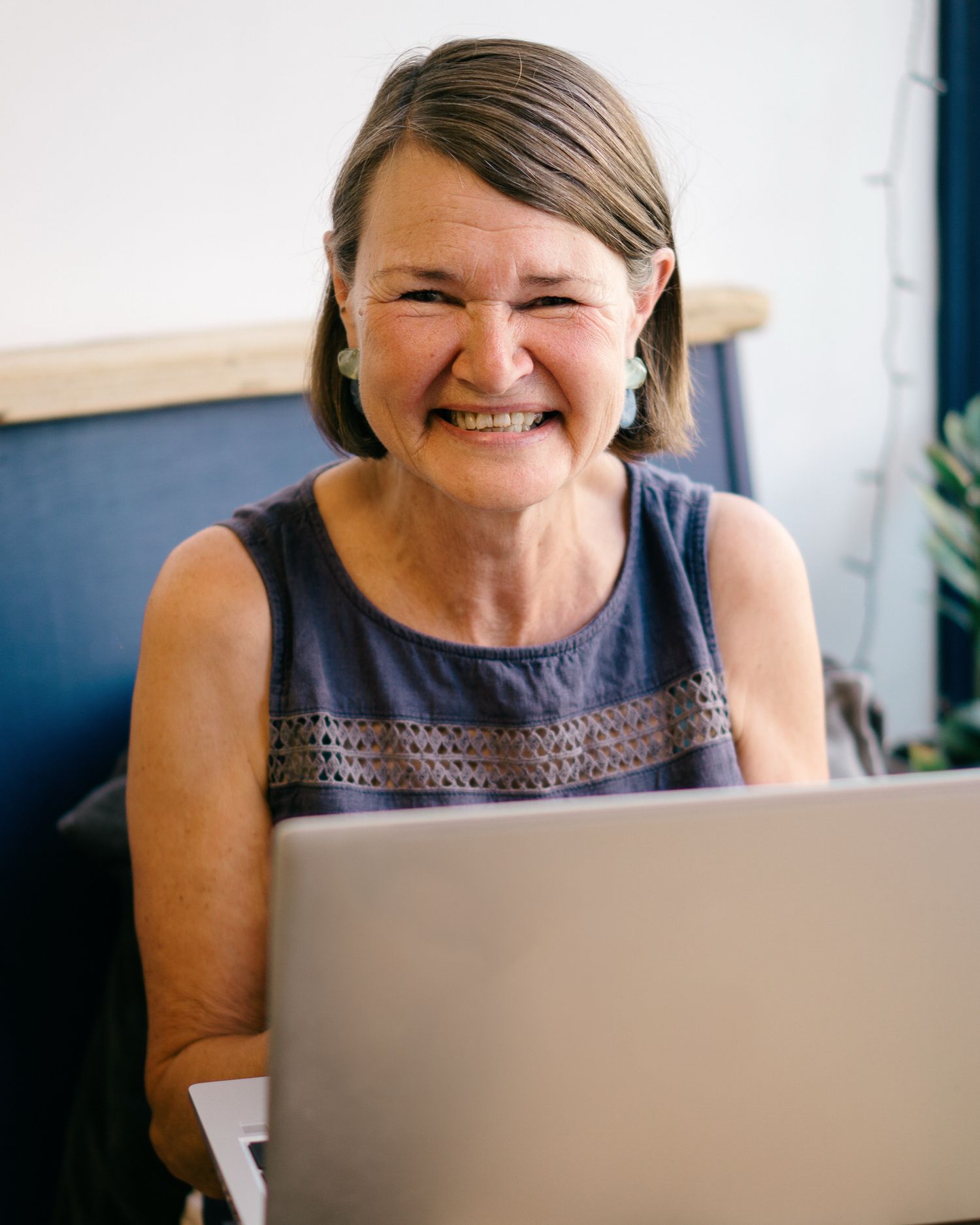 smiling Mid Devon book shop worker on their portrait session with Felicity Billen