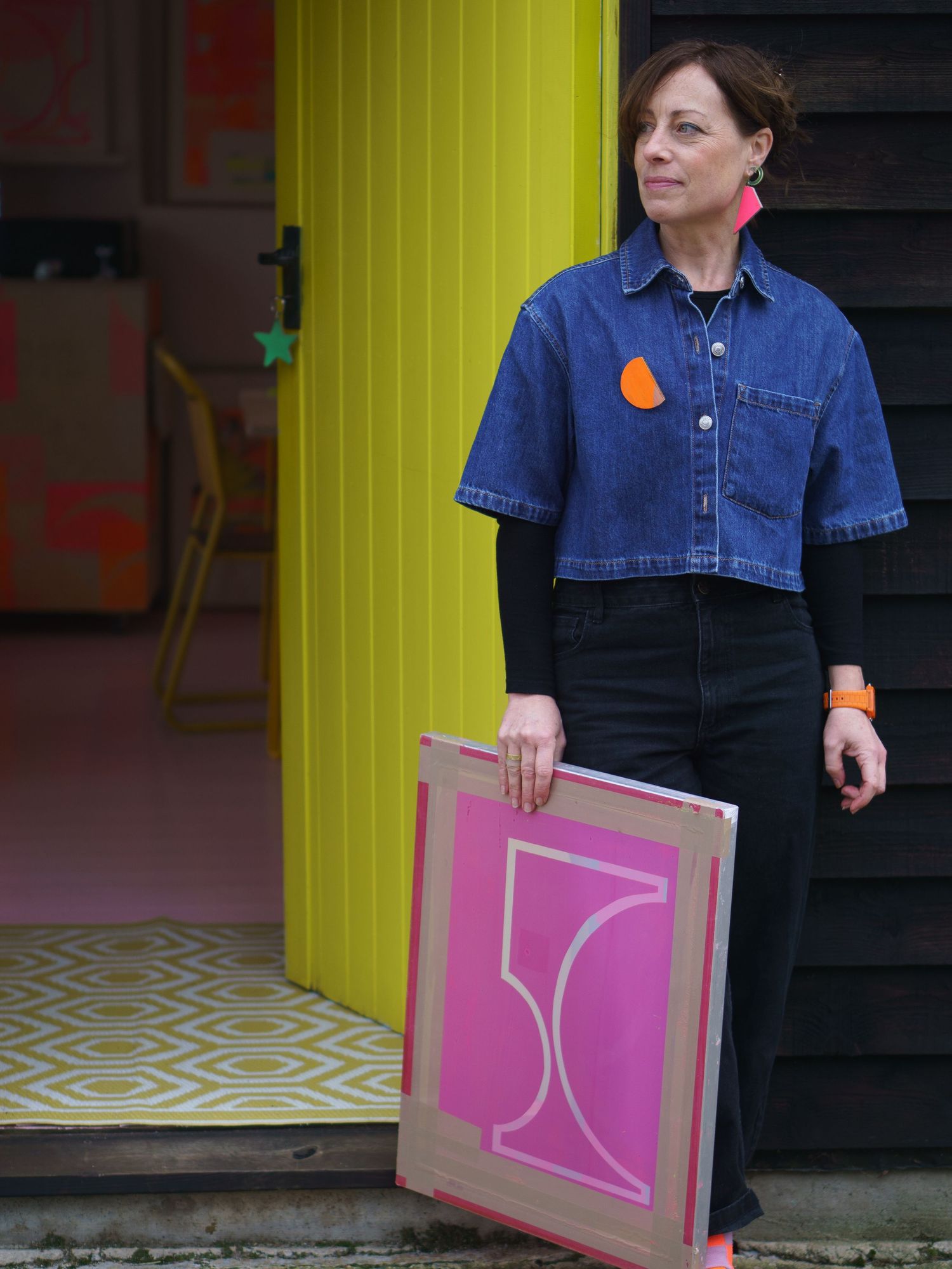Risograph printer Jo Norman standing outside her studio, looking relaxed and happy on their brand photography shoot with felicity Billen