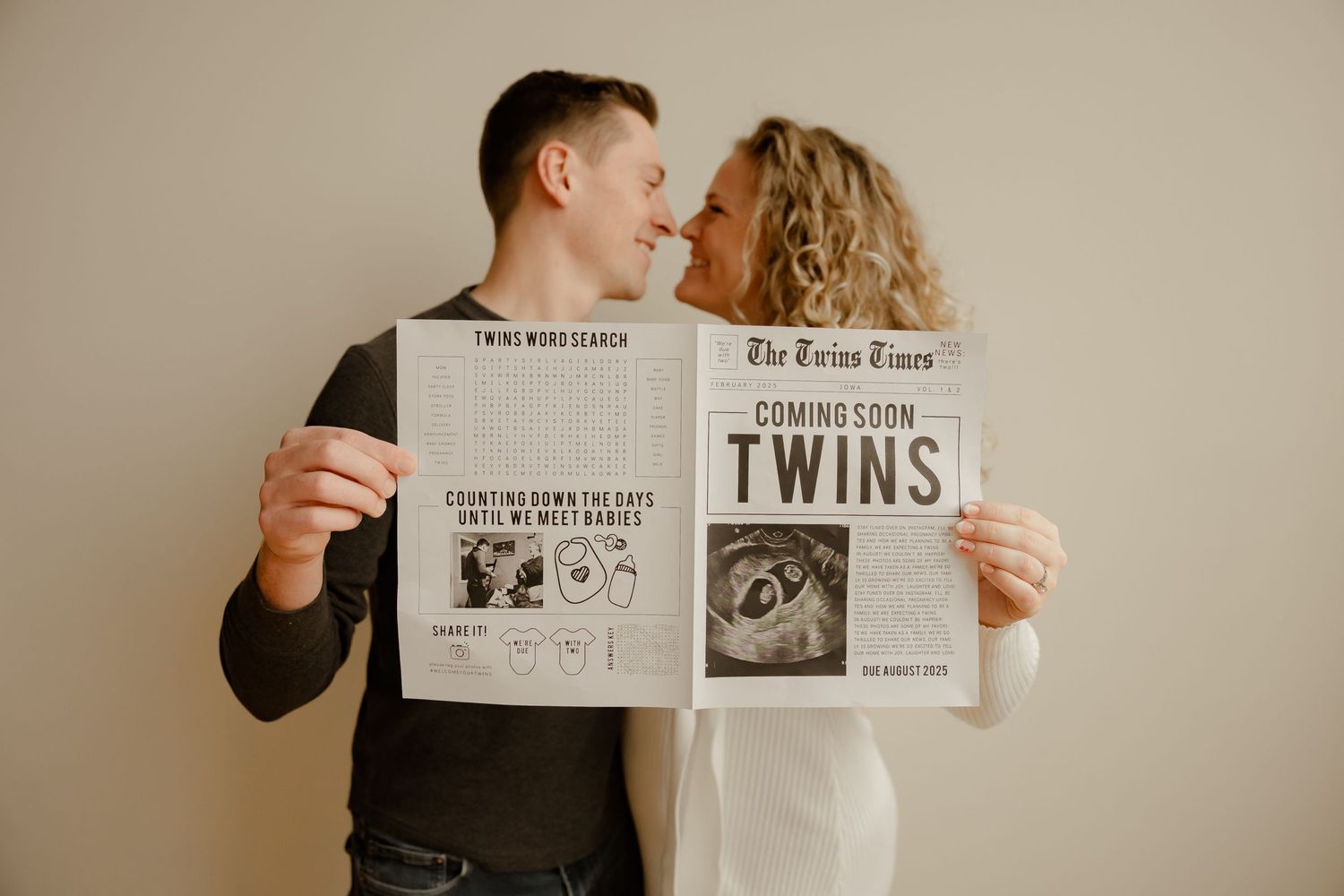 Couple holds up newspaper with ultrasound photo, announcing they are expecting twins in vintage-inspired pregnancy reveal.