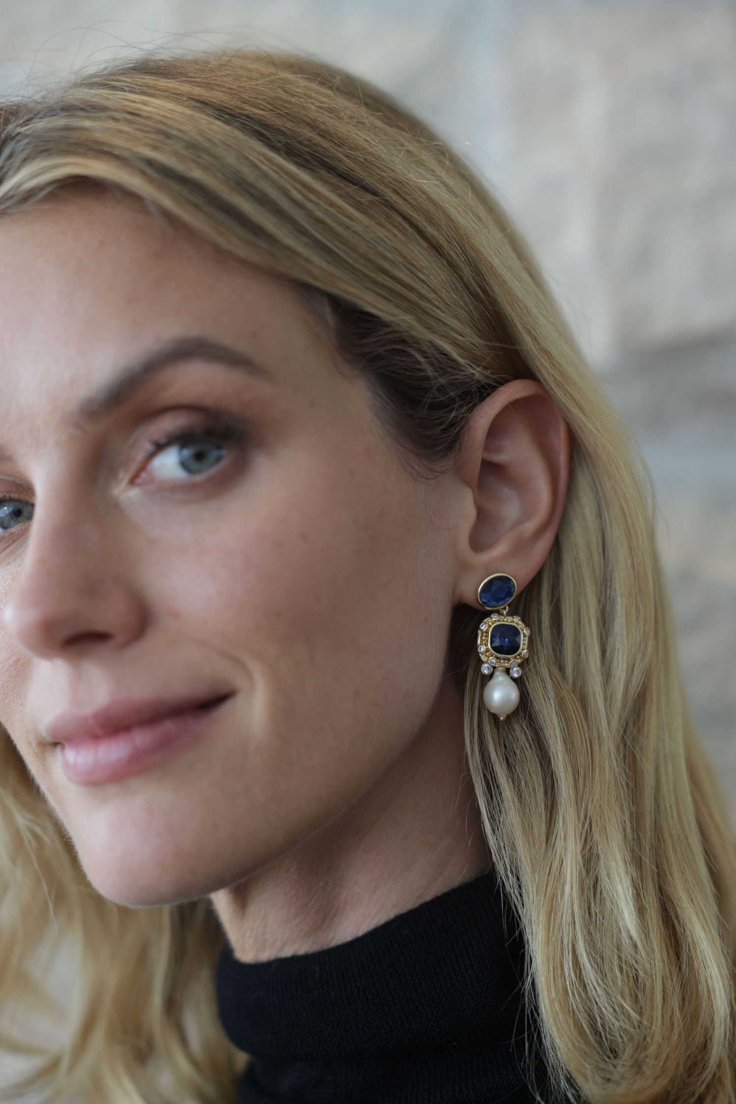 Close-up of blonde woman wearing earrings