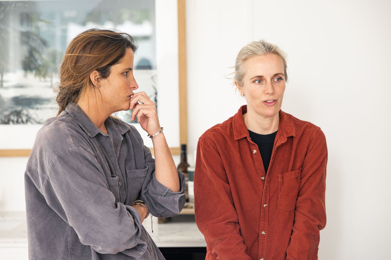 Director and DOP in discussion during an indoor behind-the-scenes shoot.