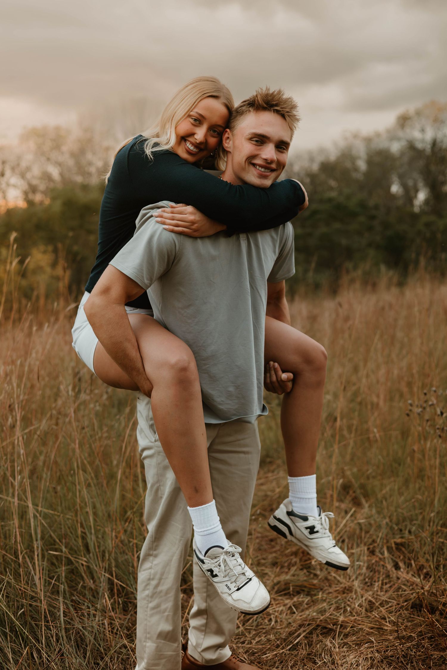 A playful piggyback ride in a golden autumn field at sunset.