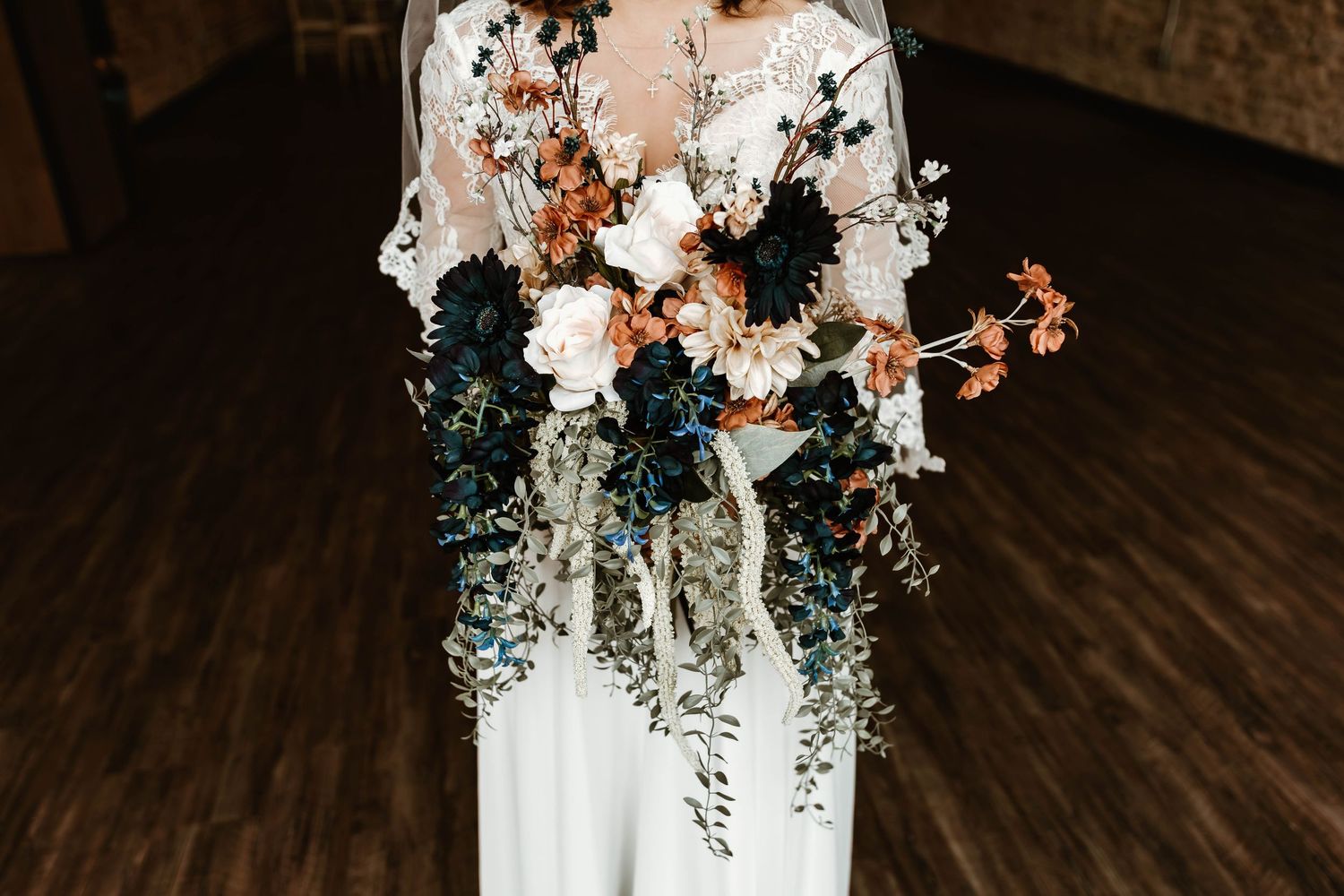Romantic floral arrangements with white and blush flowers against dark background.