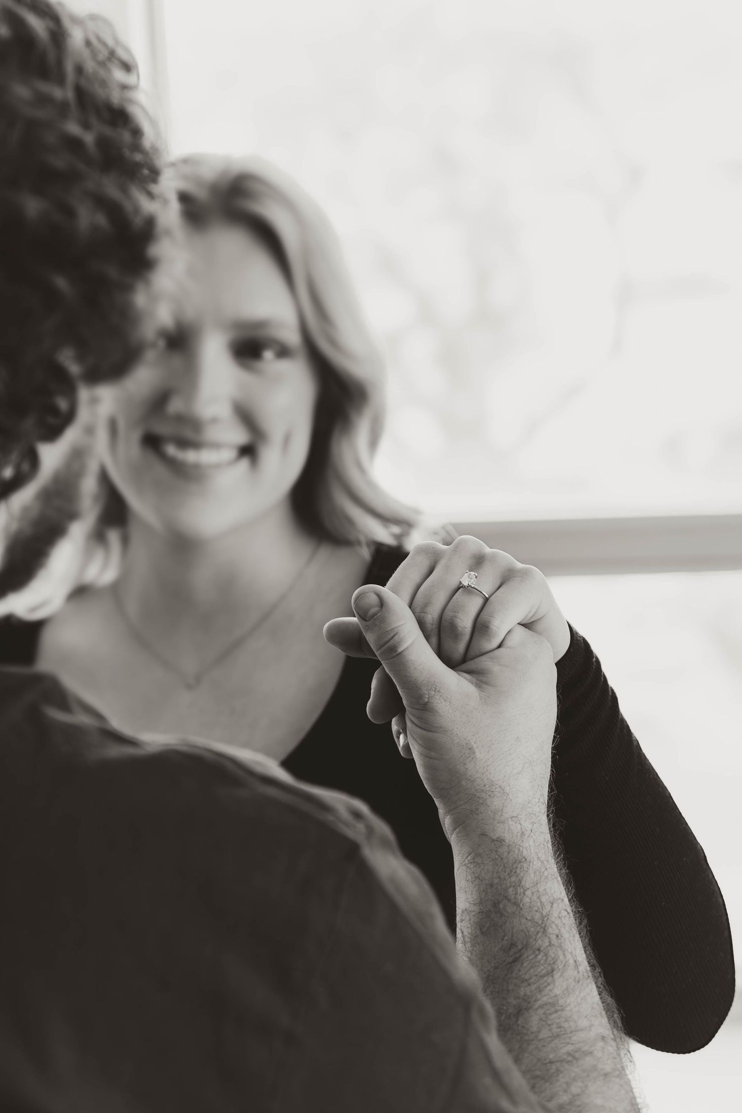 A sequence of black and white portraits showing candid moments and natural expressions in a casual photoshoot.