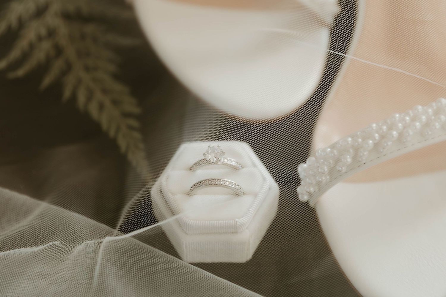 Delicate white floral arrangements with baby's breath and decorative elements in soft beige tones.