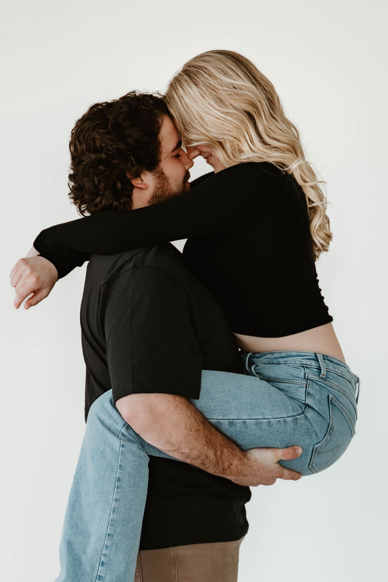 A series of intimate embrace photos showing a couple in casual attire against a white background.