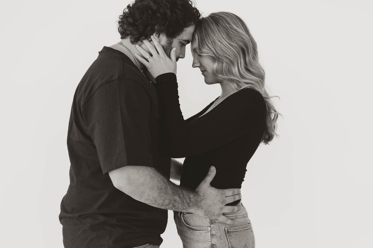 A romantic black and white photo collage showing three intimate dance poses between a couple.