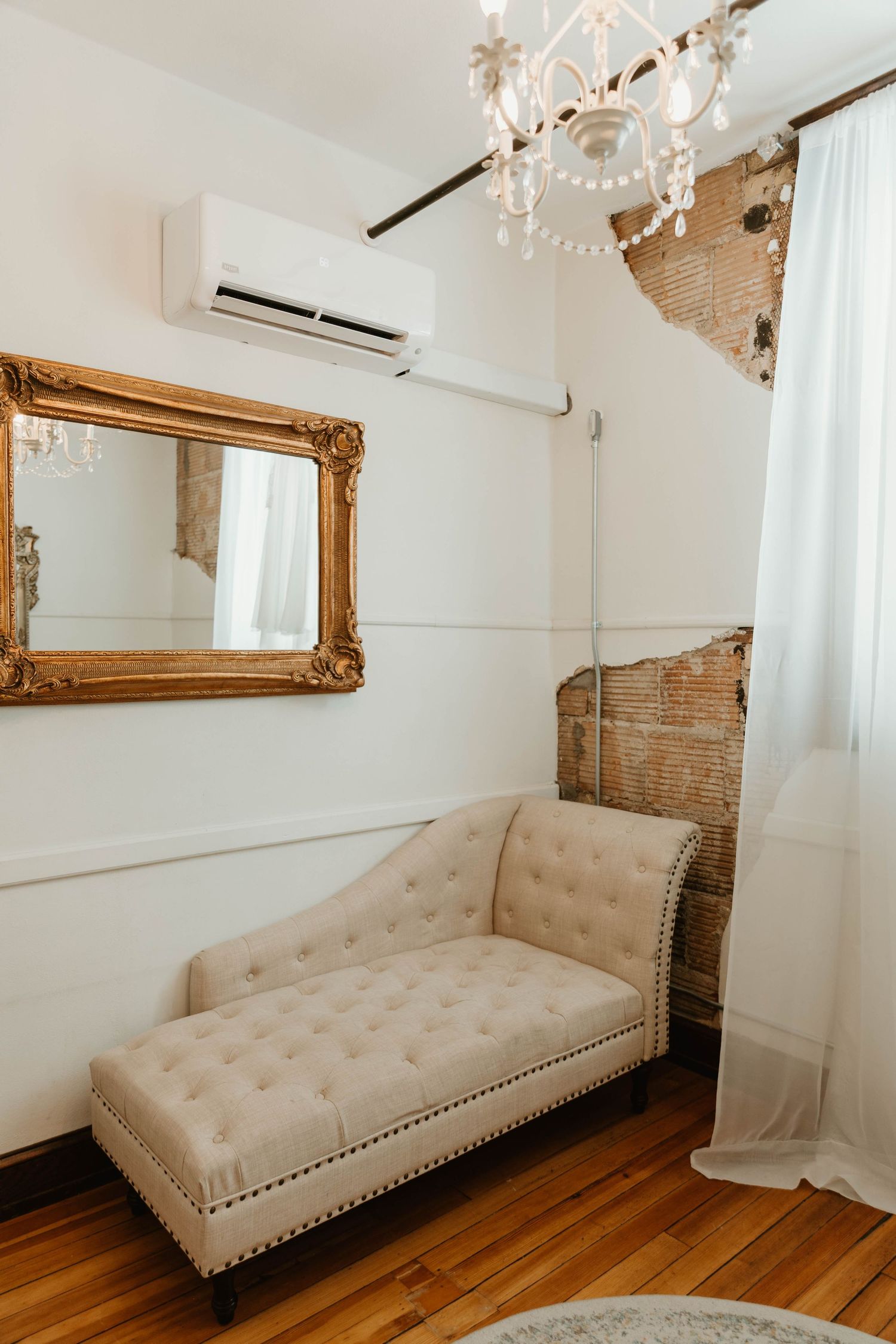 Elegant beige chaise lounge with tufted upholstery and nailhead trim shown in multiple angles against white walls.