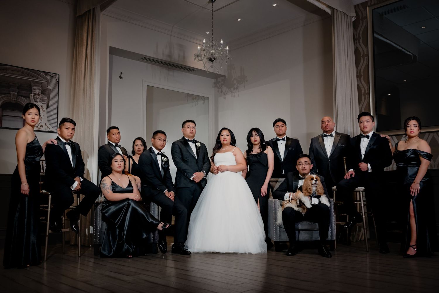 Formal wedding party portrait in elegant evening attire.