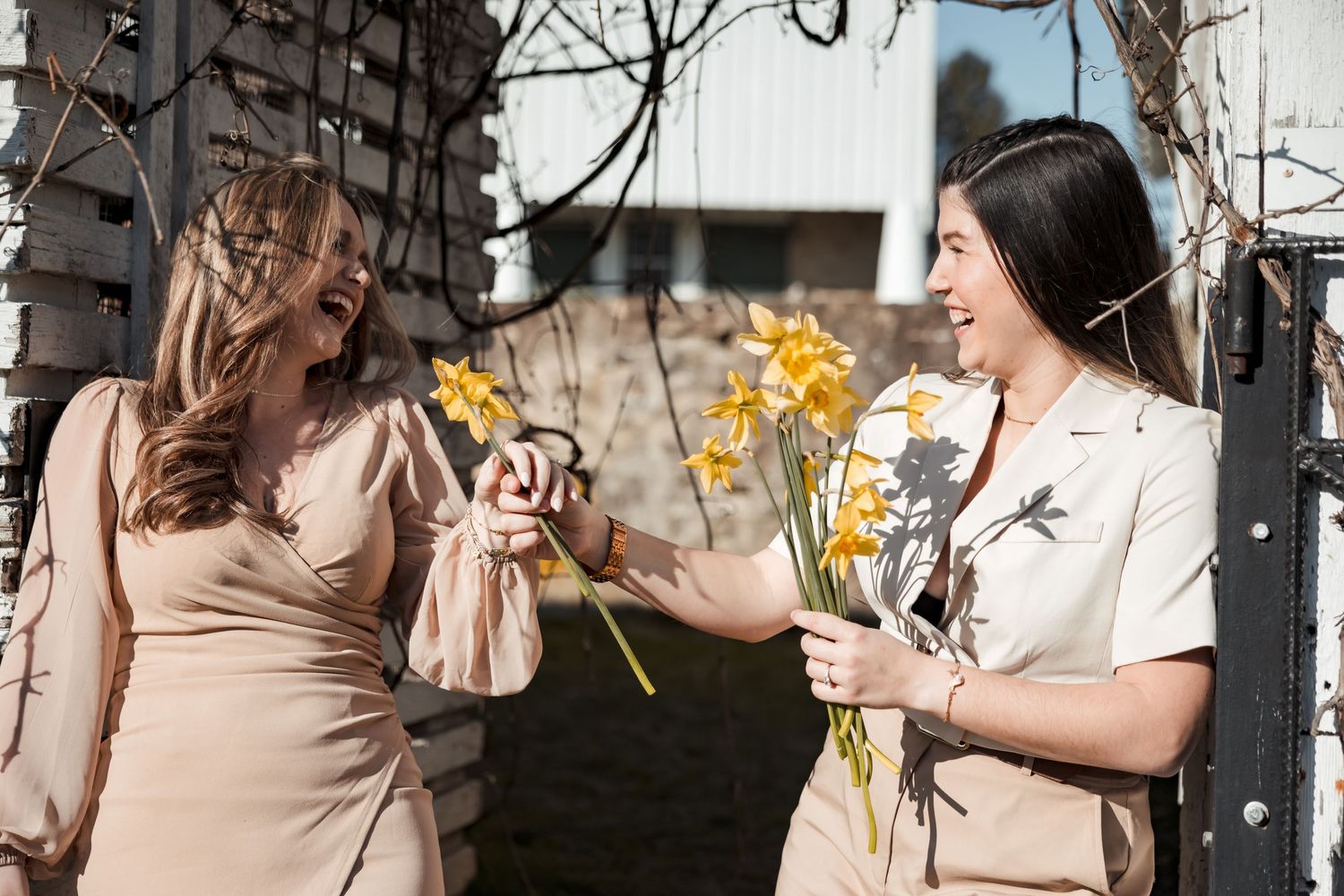 Candid engagement photo session with couple sharing intimate moments in natural lighting.