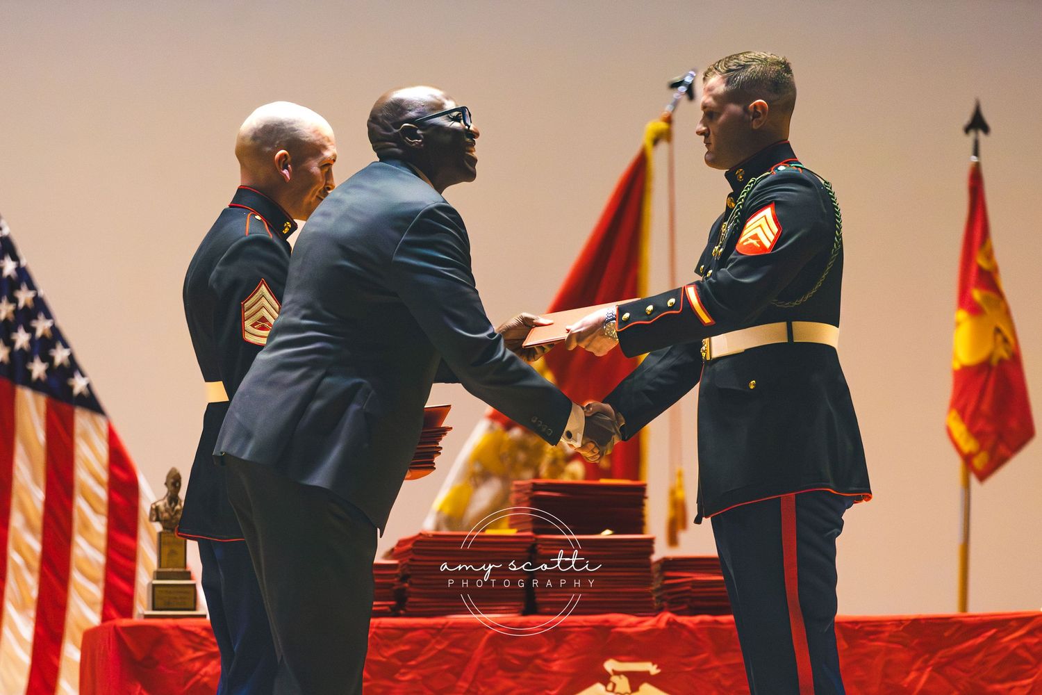 Military personnel stand in formal ceremony formation wearing dress uniforms.