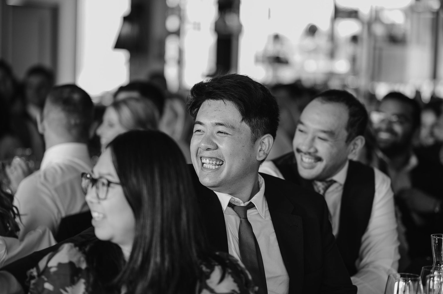 Guests enjoying themselves at a formal dinner reception.