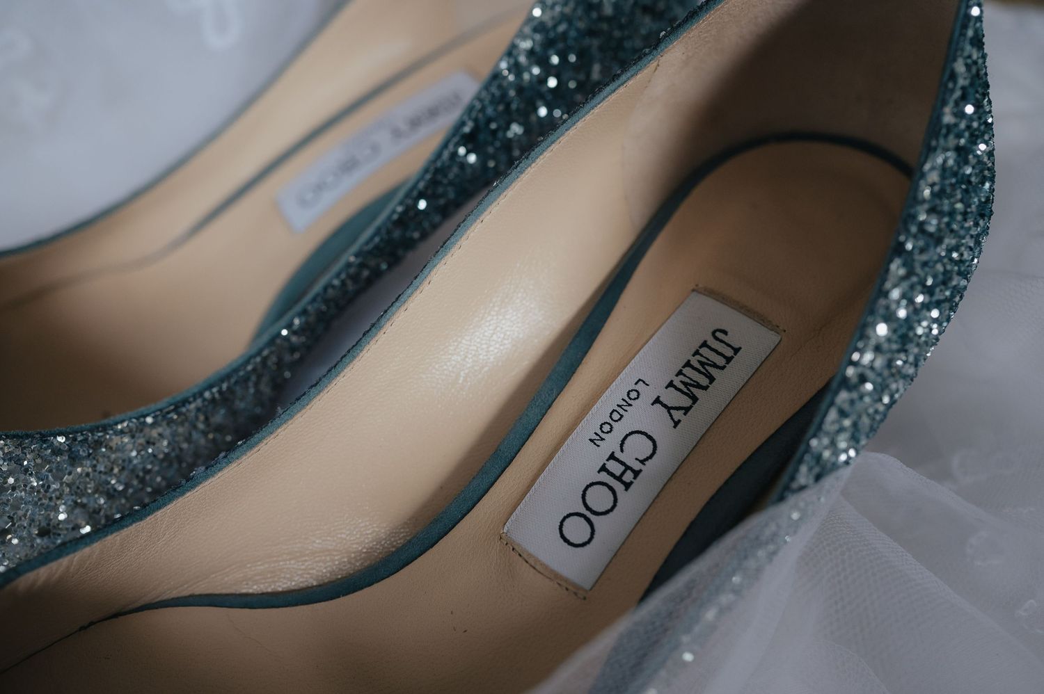 Sparkly blue Jimmy Choo bridal shoes with glitter detail.