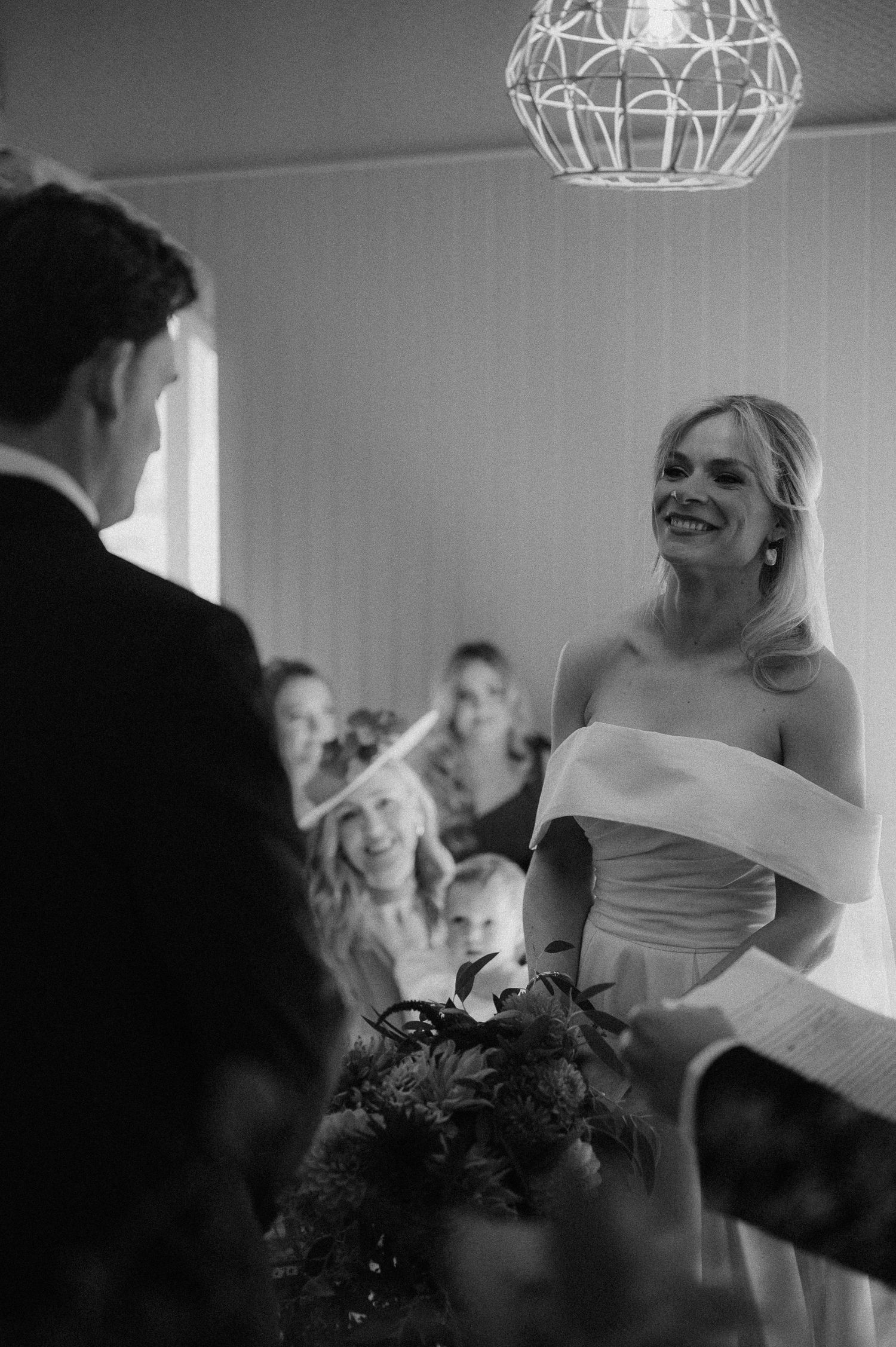 Wedding reception scene with chandelier lighting and joyful dancing moments.