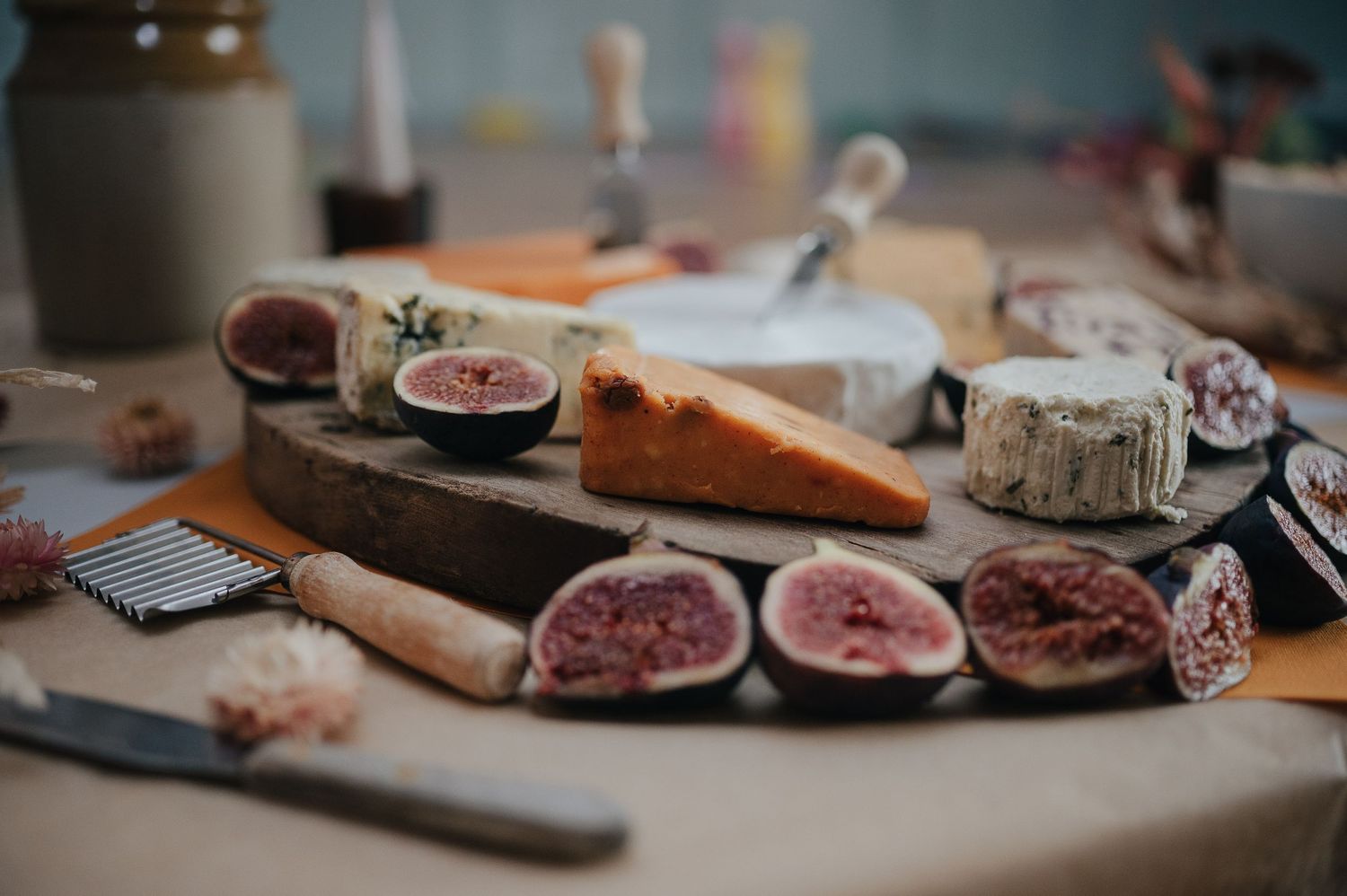 Rustic charcuterie board with figs, meats and cheeses.