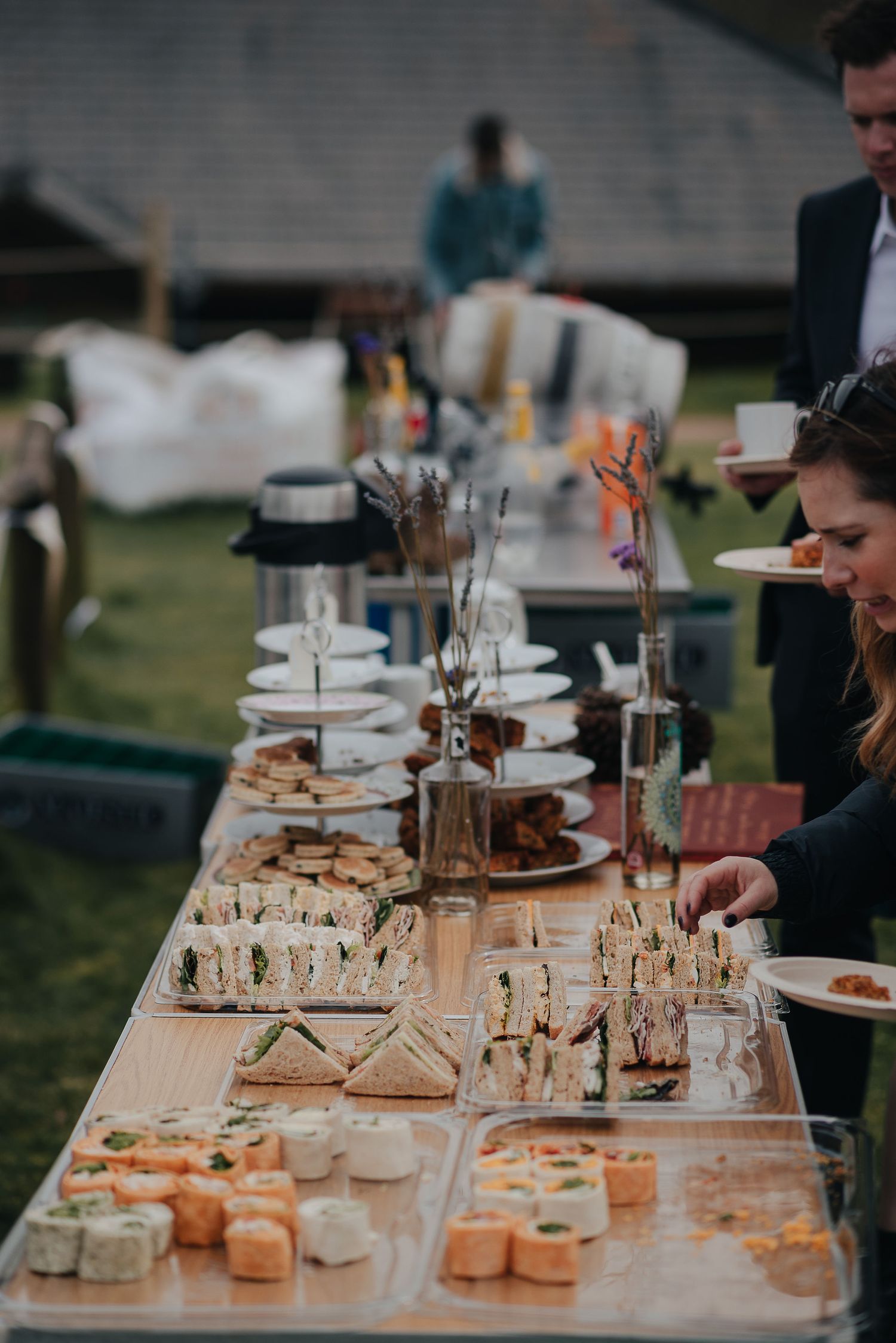 A wedding reception buffet table with elegant appetizers and hors d'oeuvres displays.