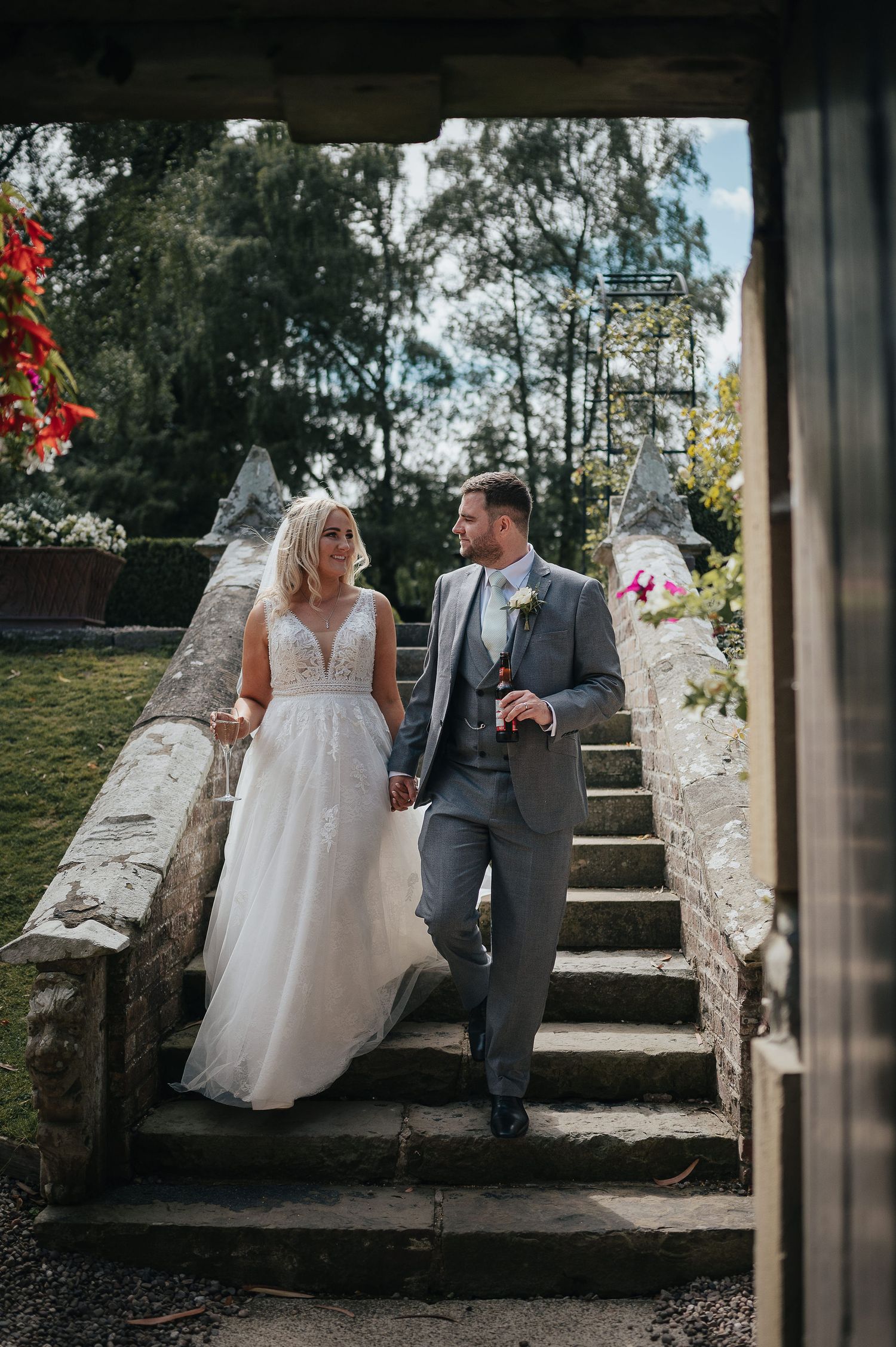 Couple sharing romantic moment on stone steps during their wedding day.