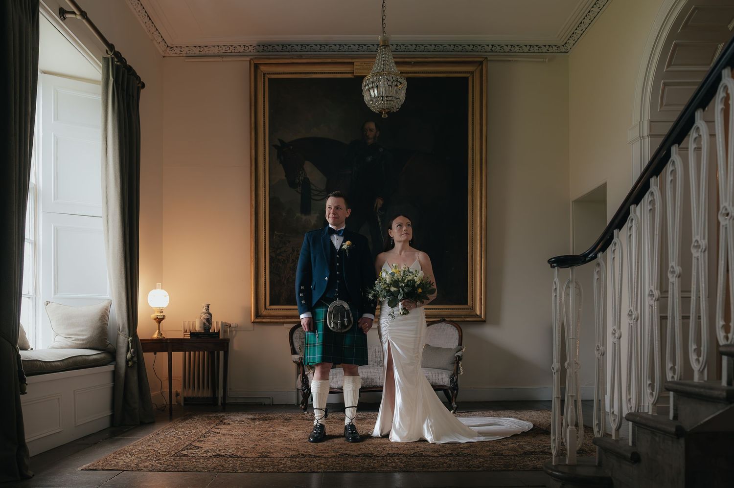 A dramatic wide-angle shot of an elegant hallway interior with classic architectural details.