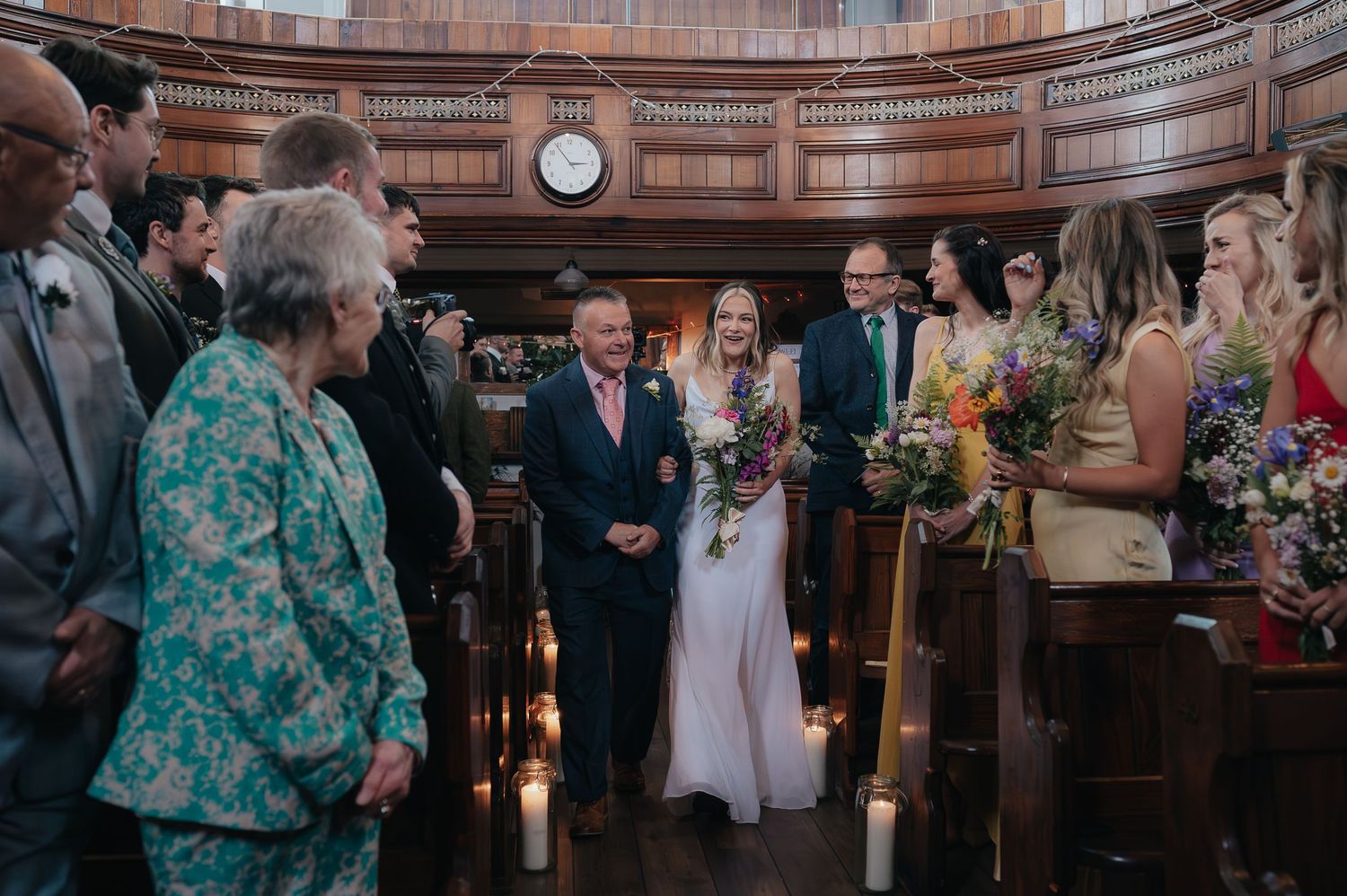 Wedding guests gather in a historic church during an intimate ceremony.