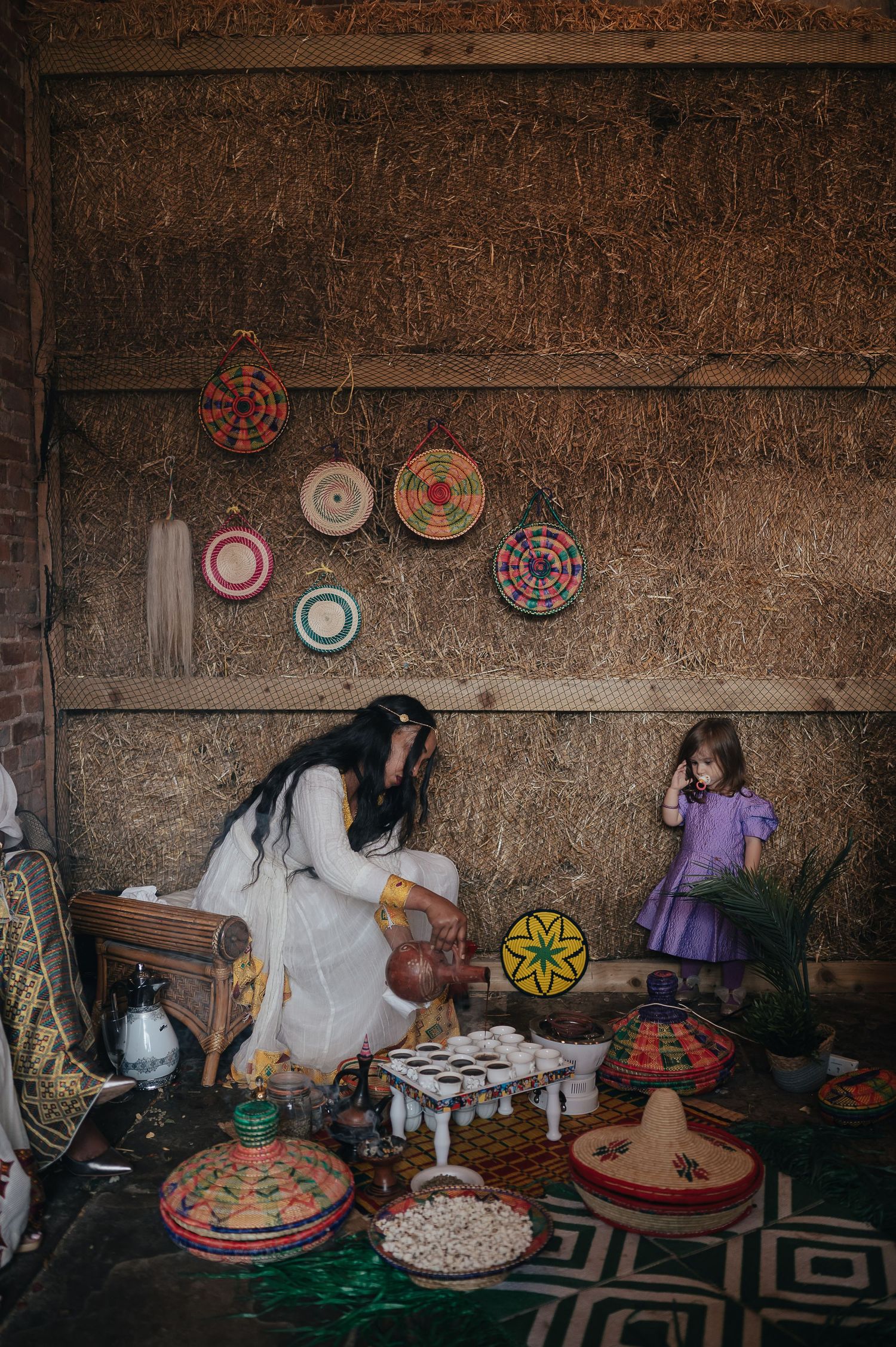 A mystical indoor setting with colorful woven baskets and decorative items on display.