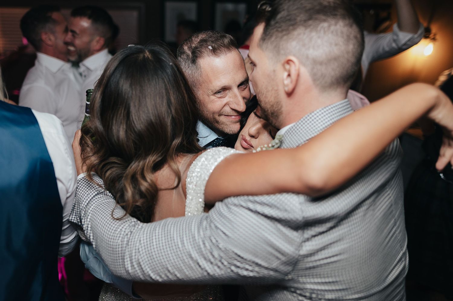 Couple enjoying an intimate dance moment at a wedding reception.