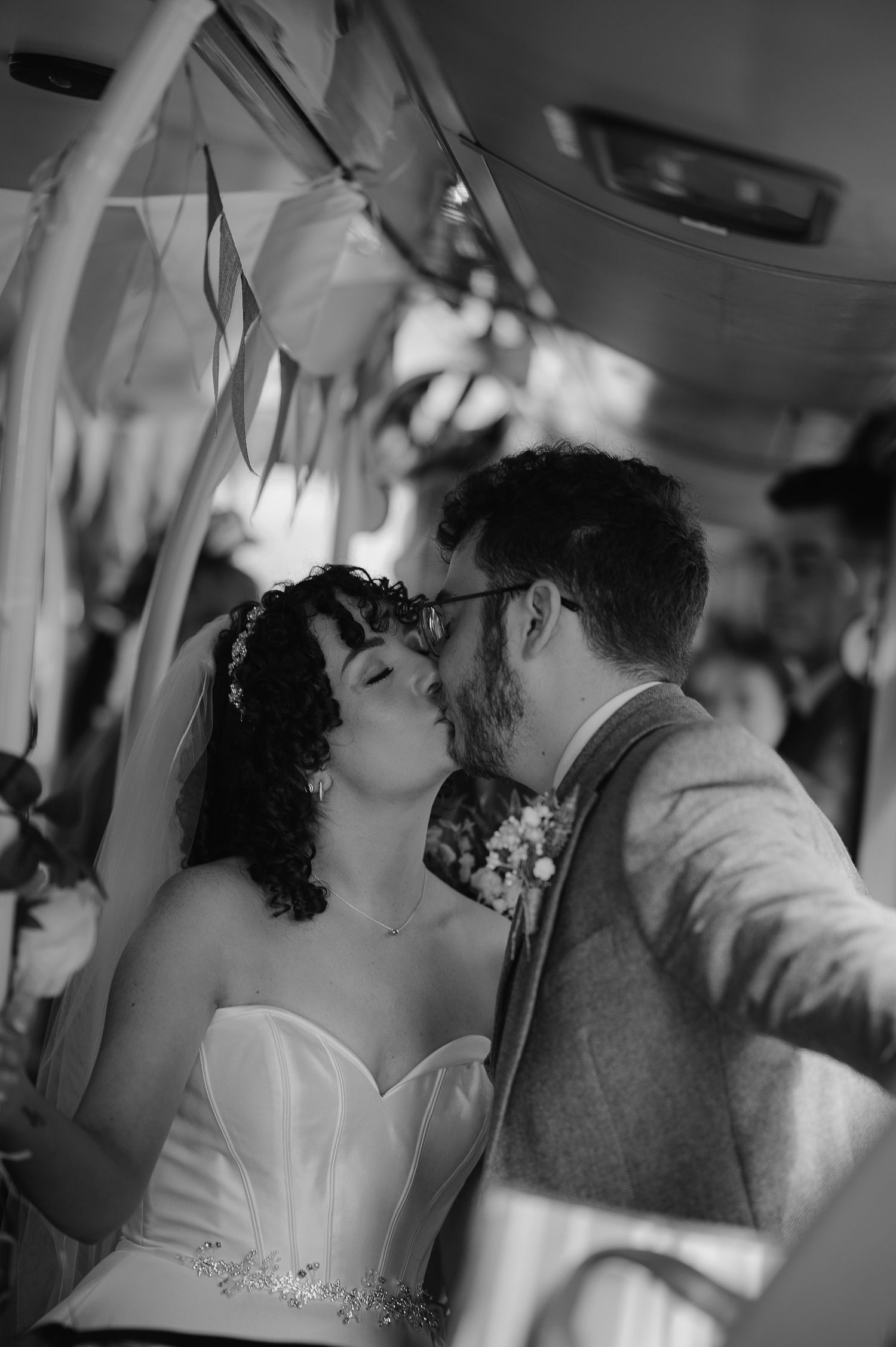 A romantic moment captured between a couple at their wedding celebration.