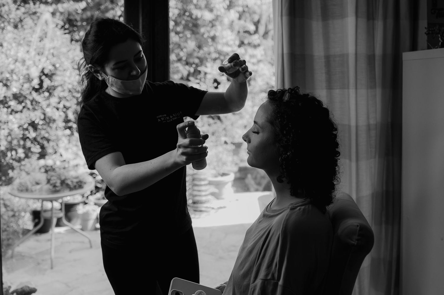 Black and white photo of styling session in natural window light.