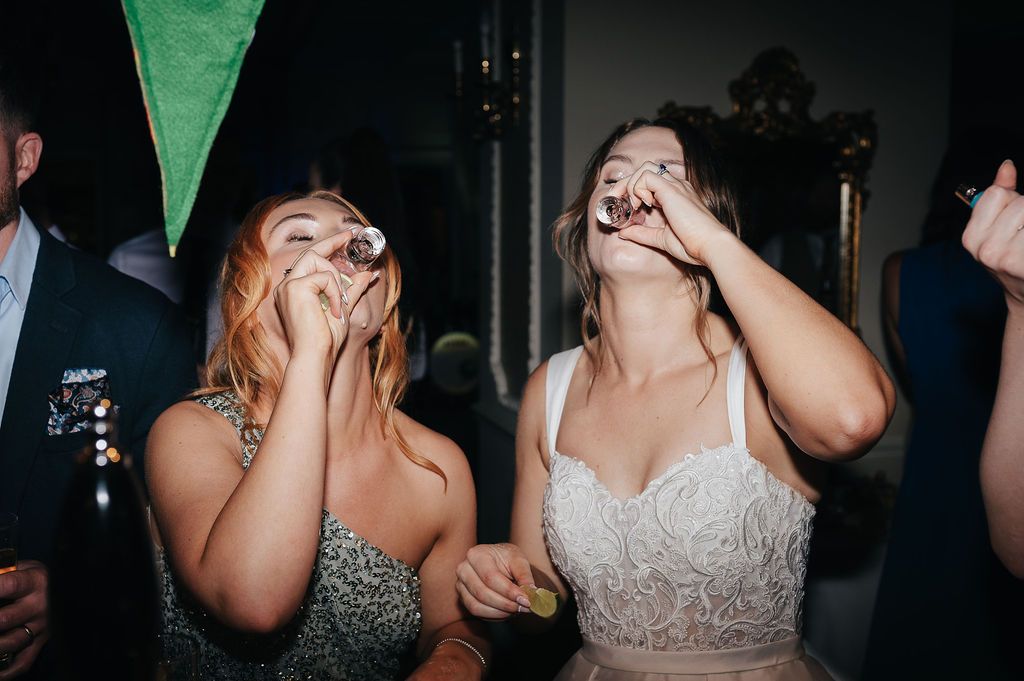 Candid moment of joyful celebration during a wedding reception party.