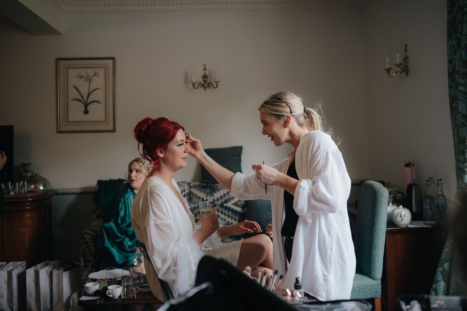Getting ready scene in a bright hotel room before the wedding ceremony.