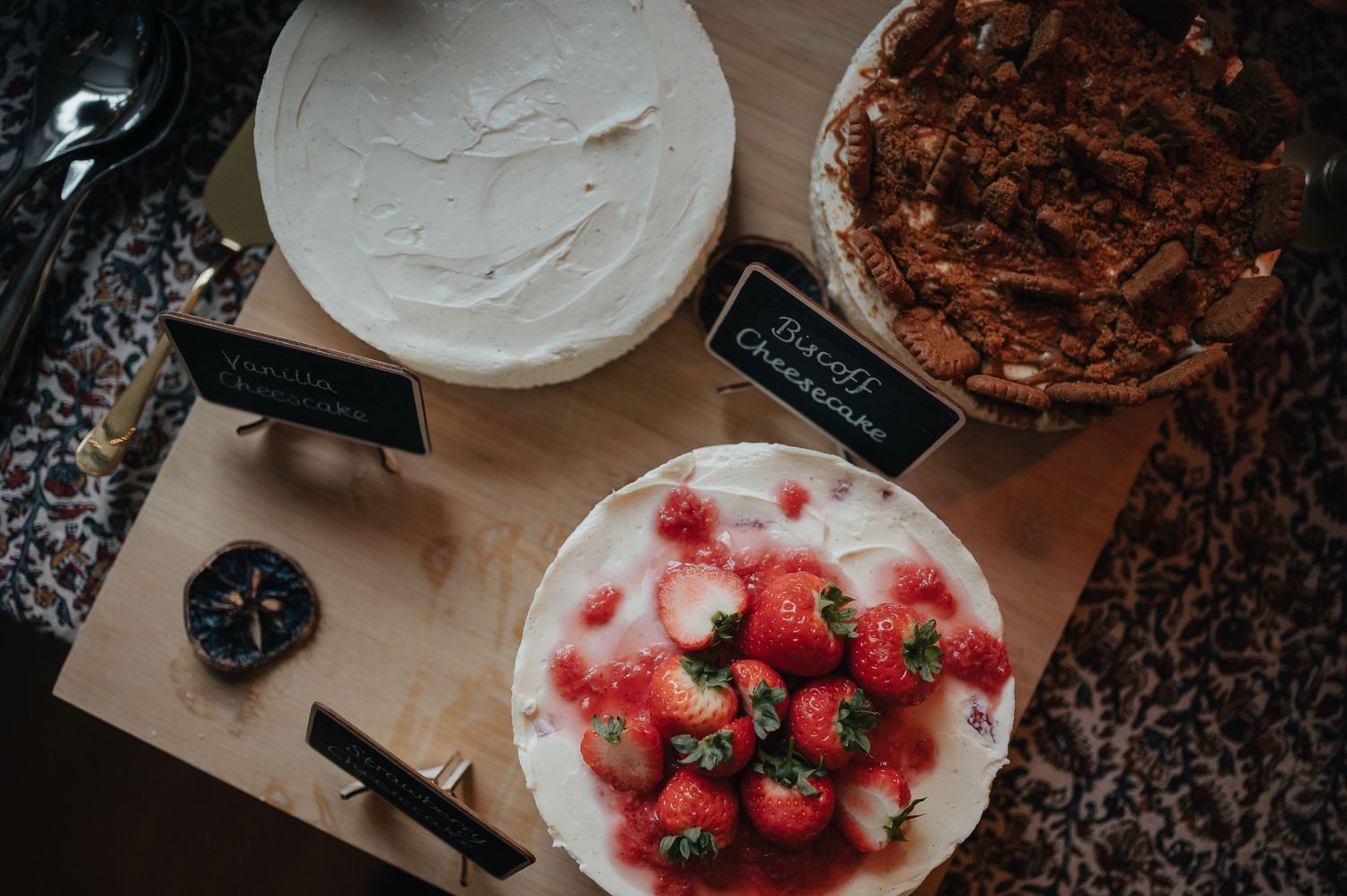Elegant dessert table with strawberries, cakes and sweet treats.