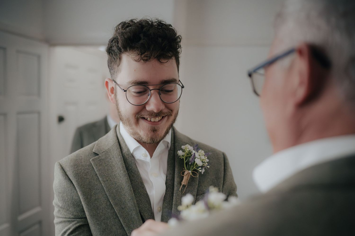 Close up shot of two people in formalwear having a conversation.