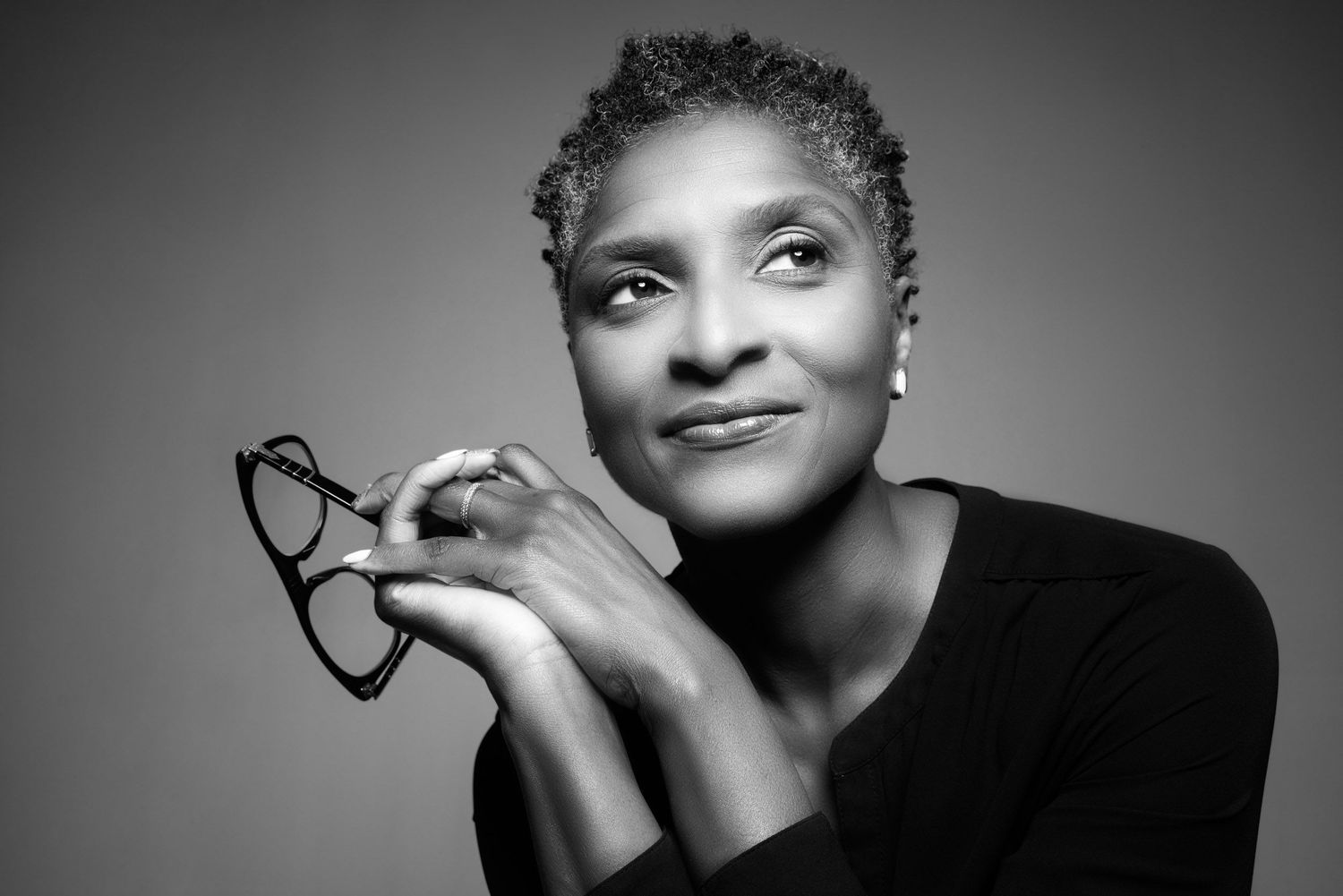 Black and white portraits showing expressive close-up poses with dramatic lighting and shadows.