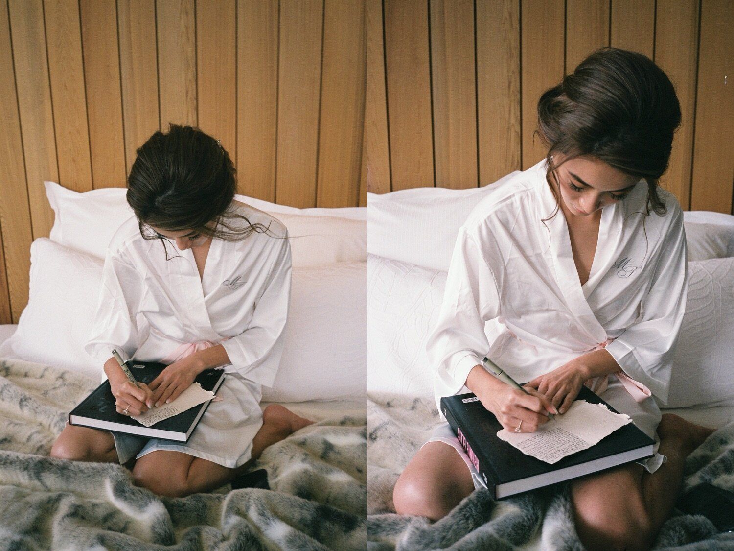 Someone in a white robe writes in a journal while sitting on a bed.