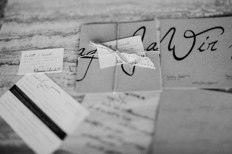 Black and white close-up of handwritten text and documents.