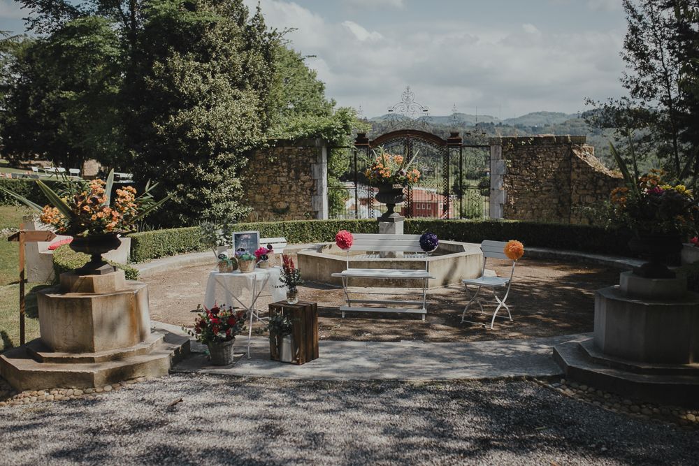 An outdoor wedding reception area with rustic decor and mountain views.