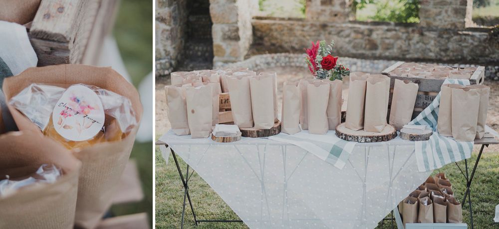 Wedding favors and decorative items arranged on a white lace-covered table.