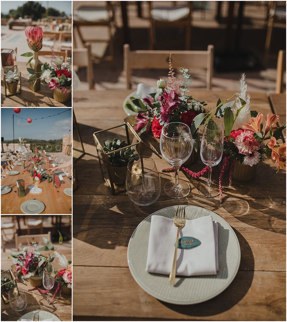 Elegant table settings with pink floral arrangements and wine glasses on wooden farmhouse tables.