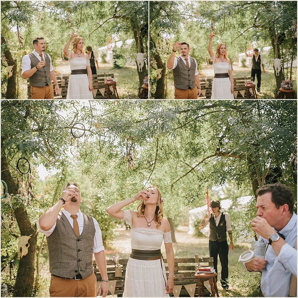 Joyful outdoor celebration with string lights and natural greenery overhead.
